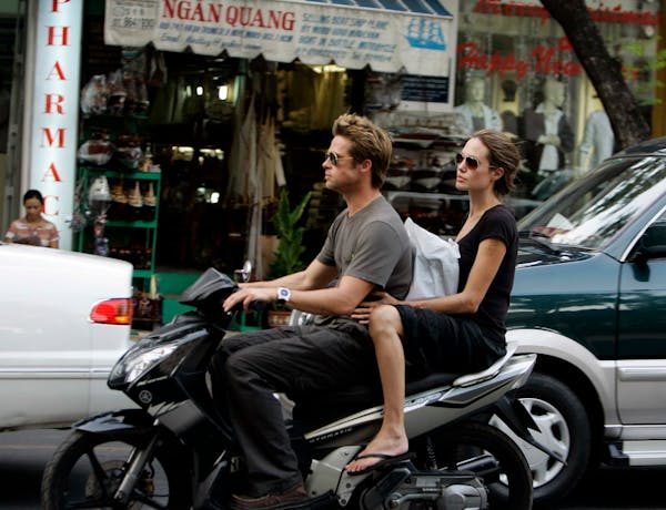Brad Pitt and Angelina Jolie spent Thanksgiving, Thursday, Nov. 23, 2006 cruising on a motorbike while touring Ho Chi Minh City, Vietnam. Prior to arr