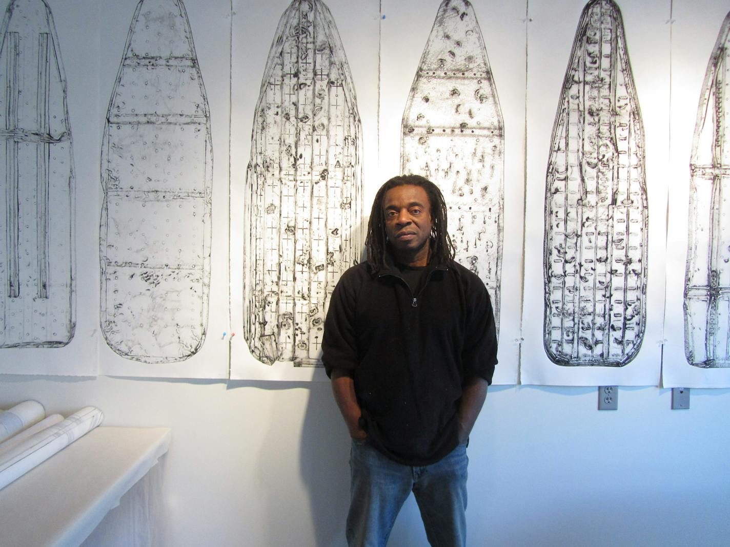 Willie Cole used flattened metal ironing boards as printing plates, each bearing scars from the process.