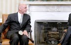 President Barack Obama speaks to Afghan President Ashraf Ghani during a restricted bilateral meeting in the Oval Office of the White House on Tuesday,