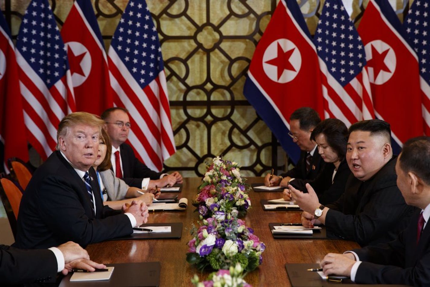 President Donald Trump listened as North Korean leader Kim Jong Un answered a question from reporters during a meeting Thursday in Hanoi.