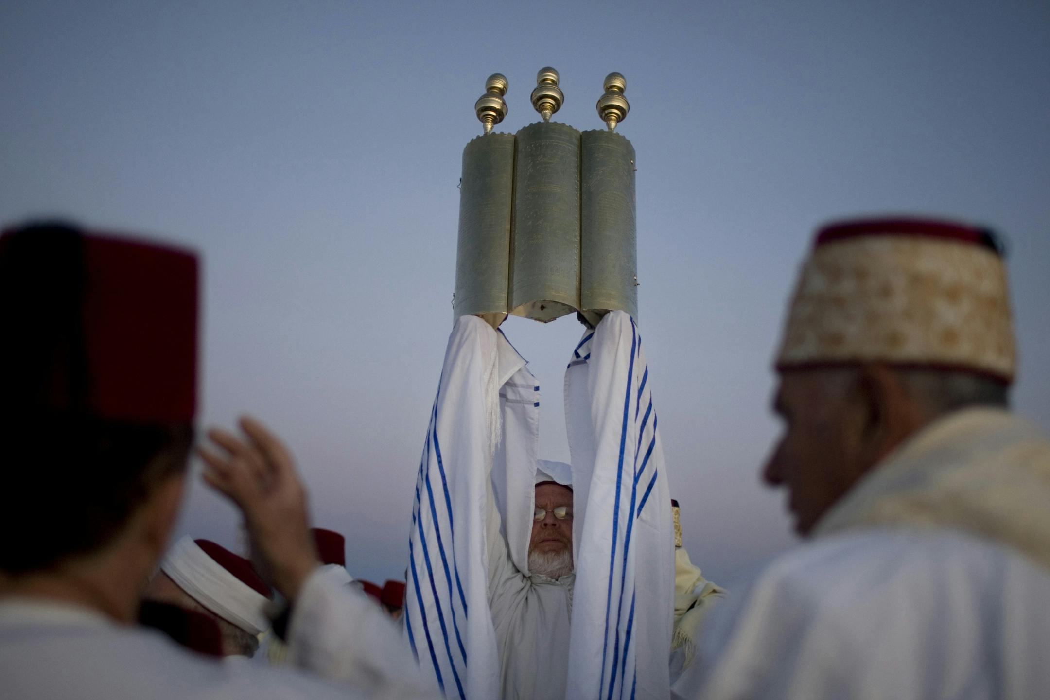 Members of the Samaritan community pray during a pilgrimage marking the end of the holy day of Passover at the religion's holiest site on Mount Gerizim in the northern West Bank, early Sunday, April 24, 2011. According to tradition, the Samaritans are descendants of Jews who were not deported when the Assyrians conquered the area in the 8th century B.C. Of the small community of close to 700 people, half live in a village at Mount Gerizim, and the rest in the city of Holon near Tel Aviv.