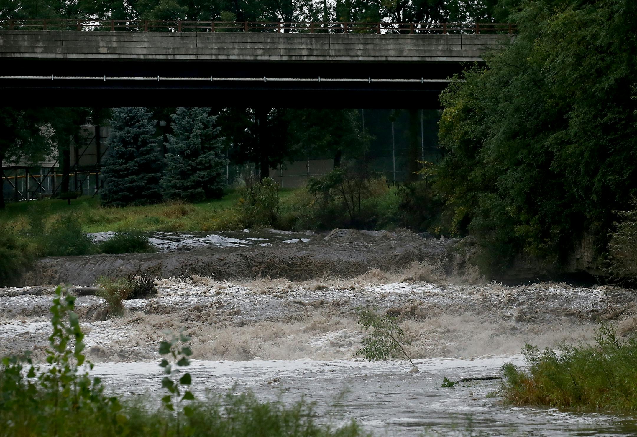 Water from torrential rains cascades over Cannon Falls on the Little Cannon River after big rainfalls Tuesday and early Wednesday, Sept. 5, 2018, in Cannon Falls, MN.