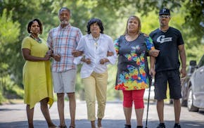 Sondra and Don Samuels, at left, stood alongside Cathy Spann, Audua Pugh and Michael Pugh in the Jordan neighborhood of Minneapolis in July.