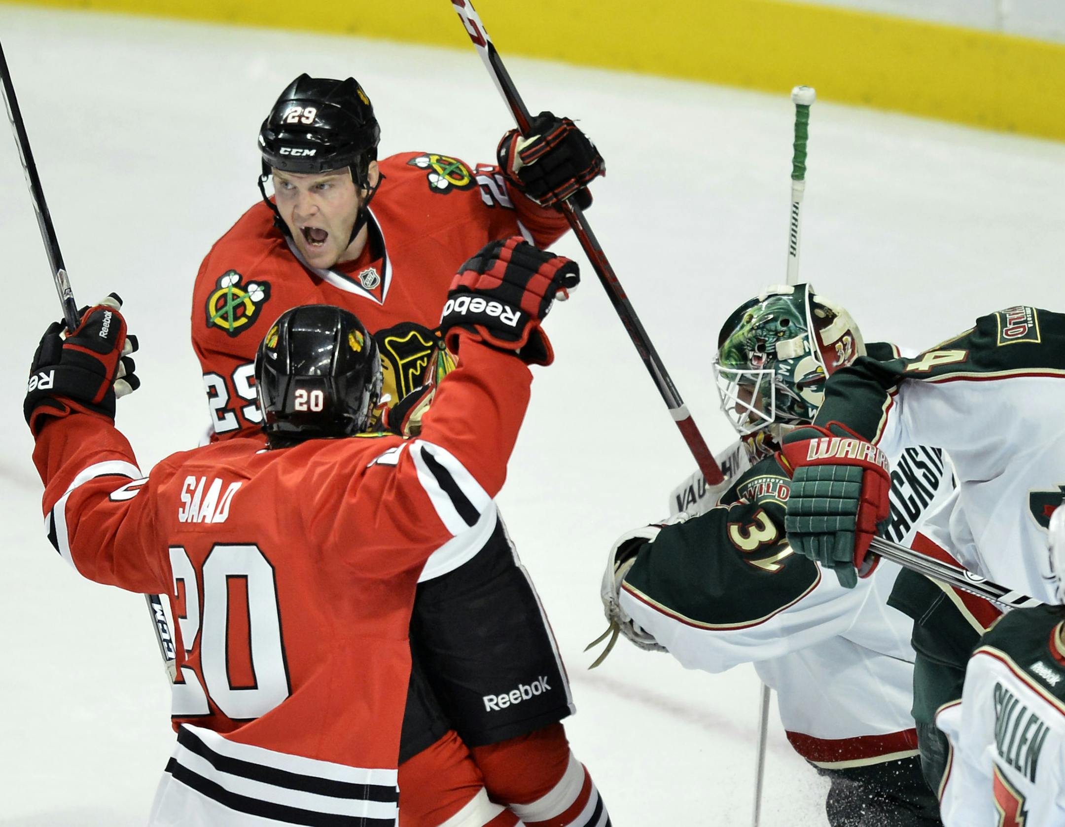 Blackhawks wingers Bryan Bickell (29) and Brandon Saad celebrated after Bickell scored past Wild goalie Niklas Backstrom on March 5.