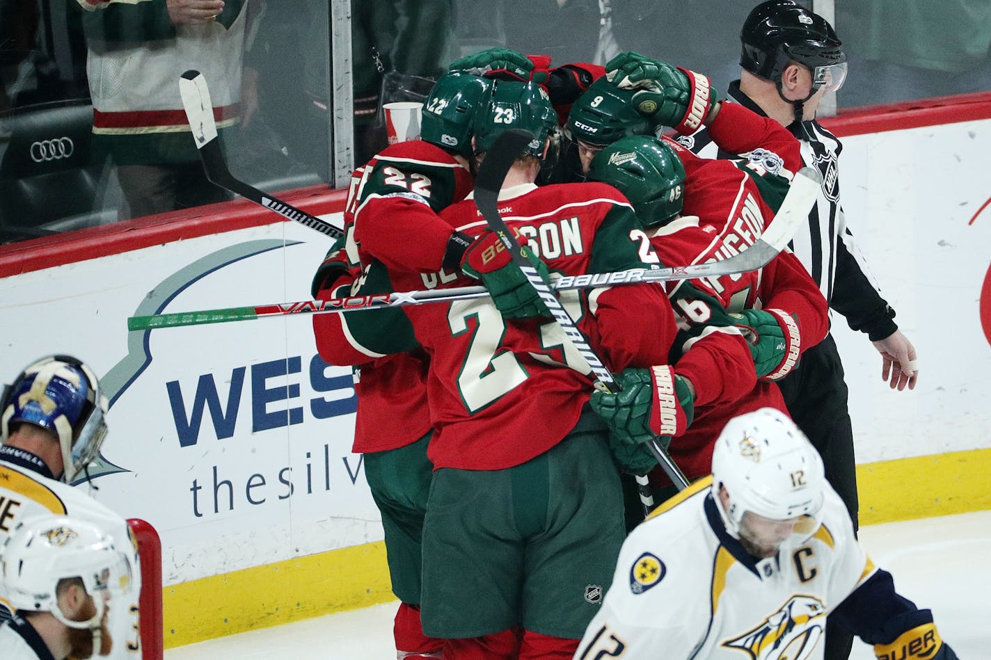 Minnesota Wild players celebrate after scoring during the first period on Saturday against Nashville.