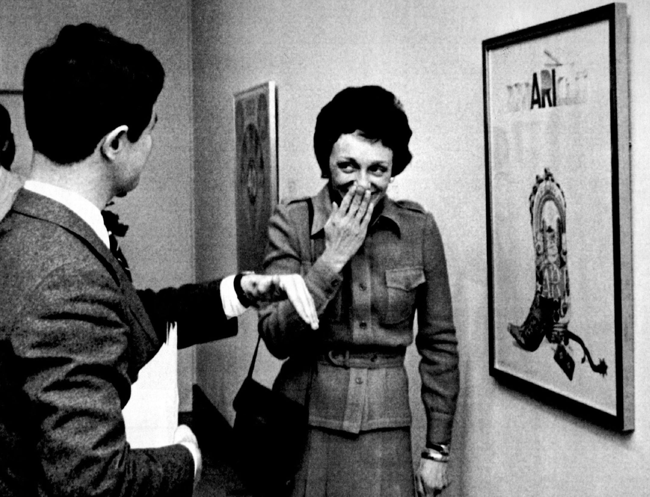 March 17, 1978 Joan Mondale, wife of Vice-President Walter Mondale, held back a giggle at the Dallas Museum of Fine Arts as she listened to museum director Harry Parker. She was in Dallas to examine art objects that will be displayed in the vice-presidential mansion for a year.