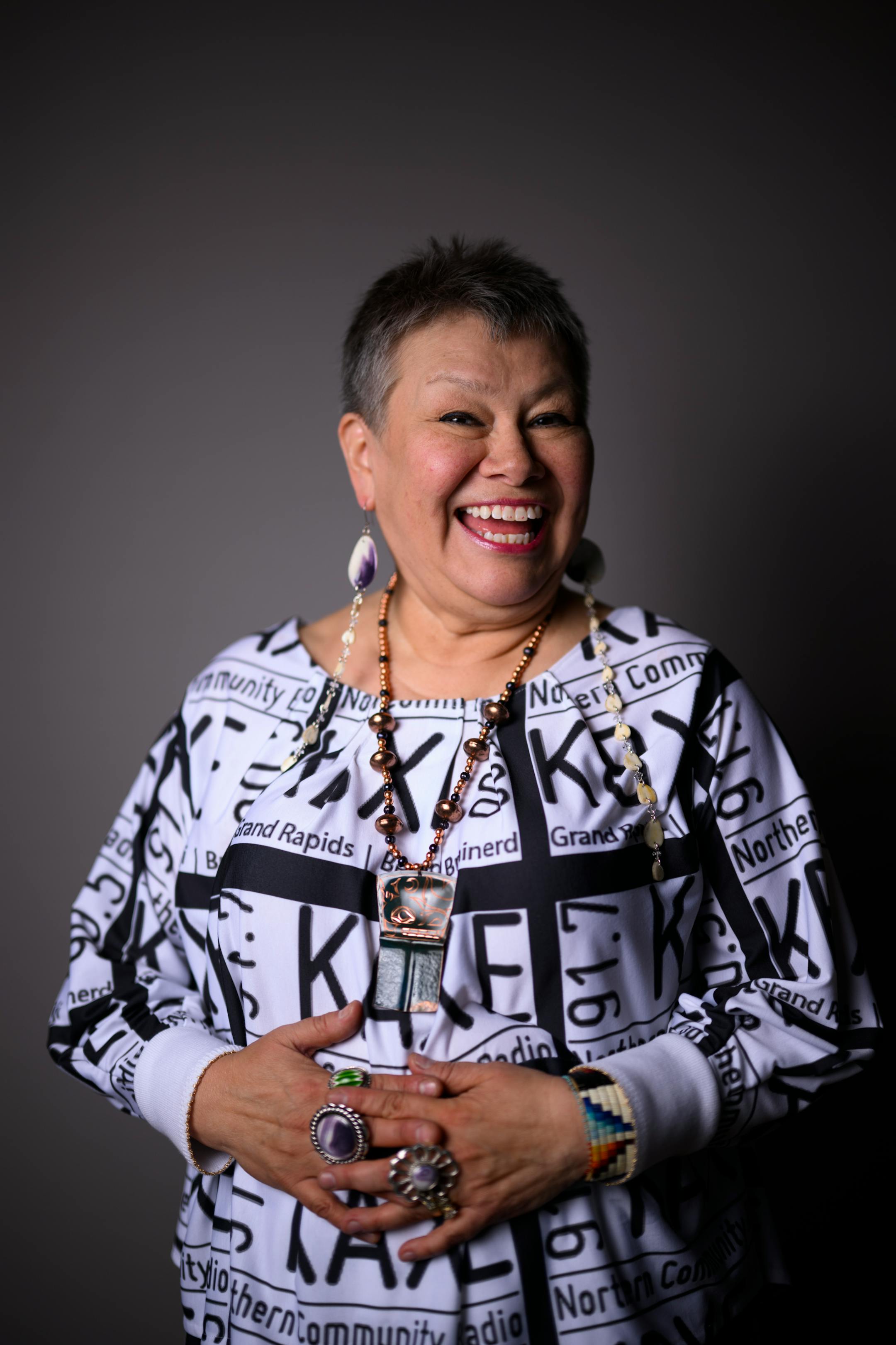 Artist Delina White, of IamAnishinaabe, stands for a portrait during "Northern Lights: A Native Nations Fashion Night."