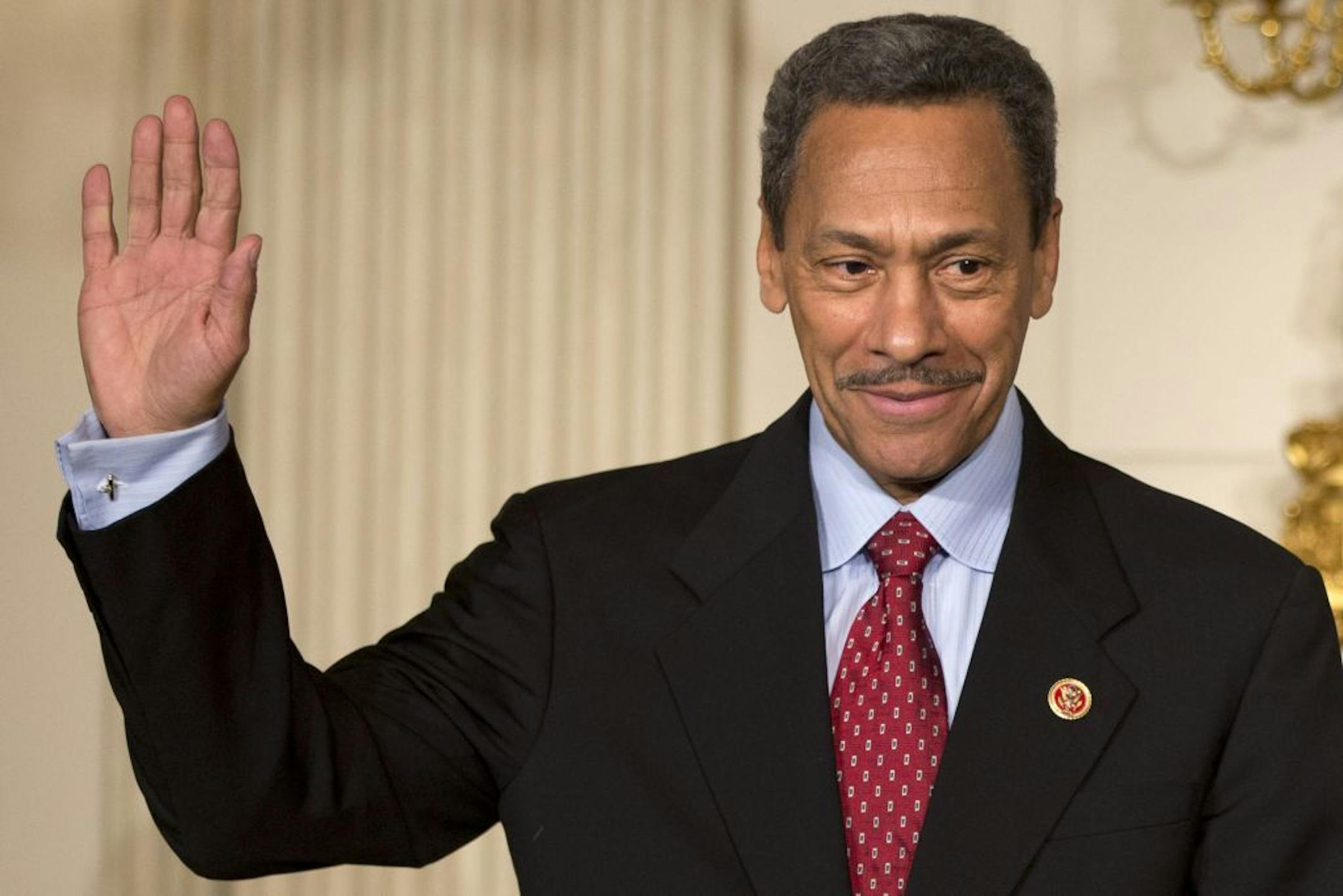 FILE - In this May 1, 2013, file photo, President Barack Obama's nominee for the Federal Housing Finance Authority director Rep. Mel Watt, D-N.C., waves during the announcement of his nomination in the State Dining Room of the White House in Washington. Democrats are struggling to halt a Republican blockade against Obama�s pick of Watt and of Patricia Millett for the U.S. Court of Appeals for the District of Columbia.