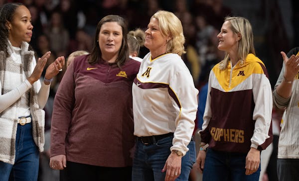 Former University of Minnesota Final Four women's basketball coach Pam Borton,right hugged former player Lindsay Whalen during a celebration of the 20