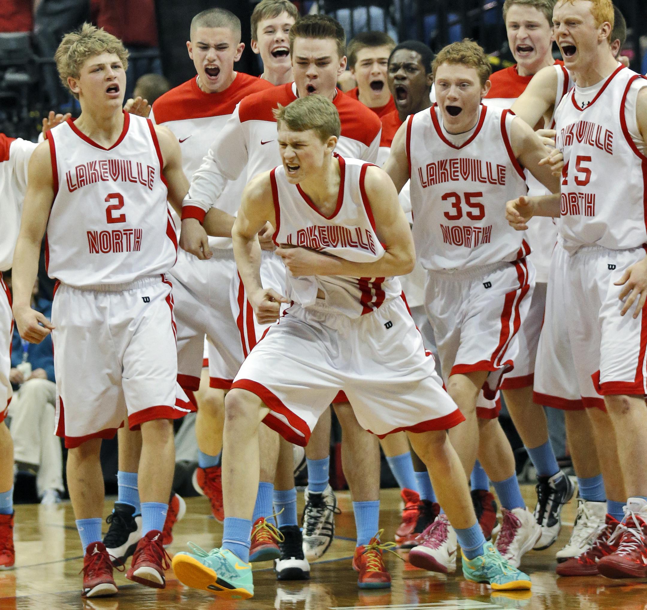 Panthers J. P. Macura hit a three-point shot with time running out in regulatiion play, then celebrated with teammates, center. Final score Lakeville North 55 - Cretin-Derham Hall 52. ] Class 4A Boys Basketball Tournament. Lakeville North Panthers vs. Cretin Derham Hall Raiders.(MARLIN LEVISON/STARTRIBUNE(mlevison@startribune.com)