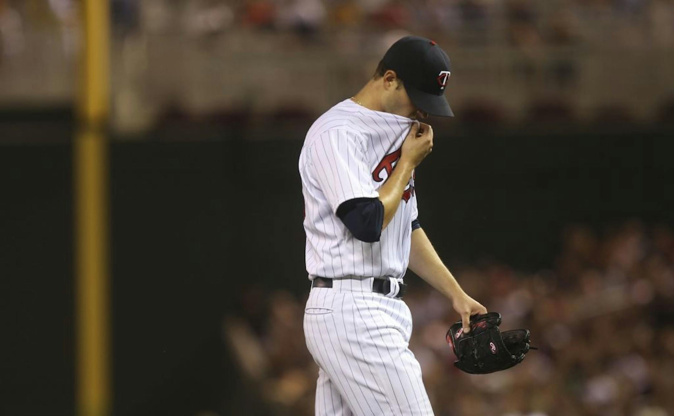 Scott Diamond walked back to the dugout after giving up four runs in the sixth inning at Target Field in Minneapolis Min., Friday, June 14, 2013.