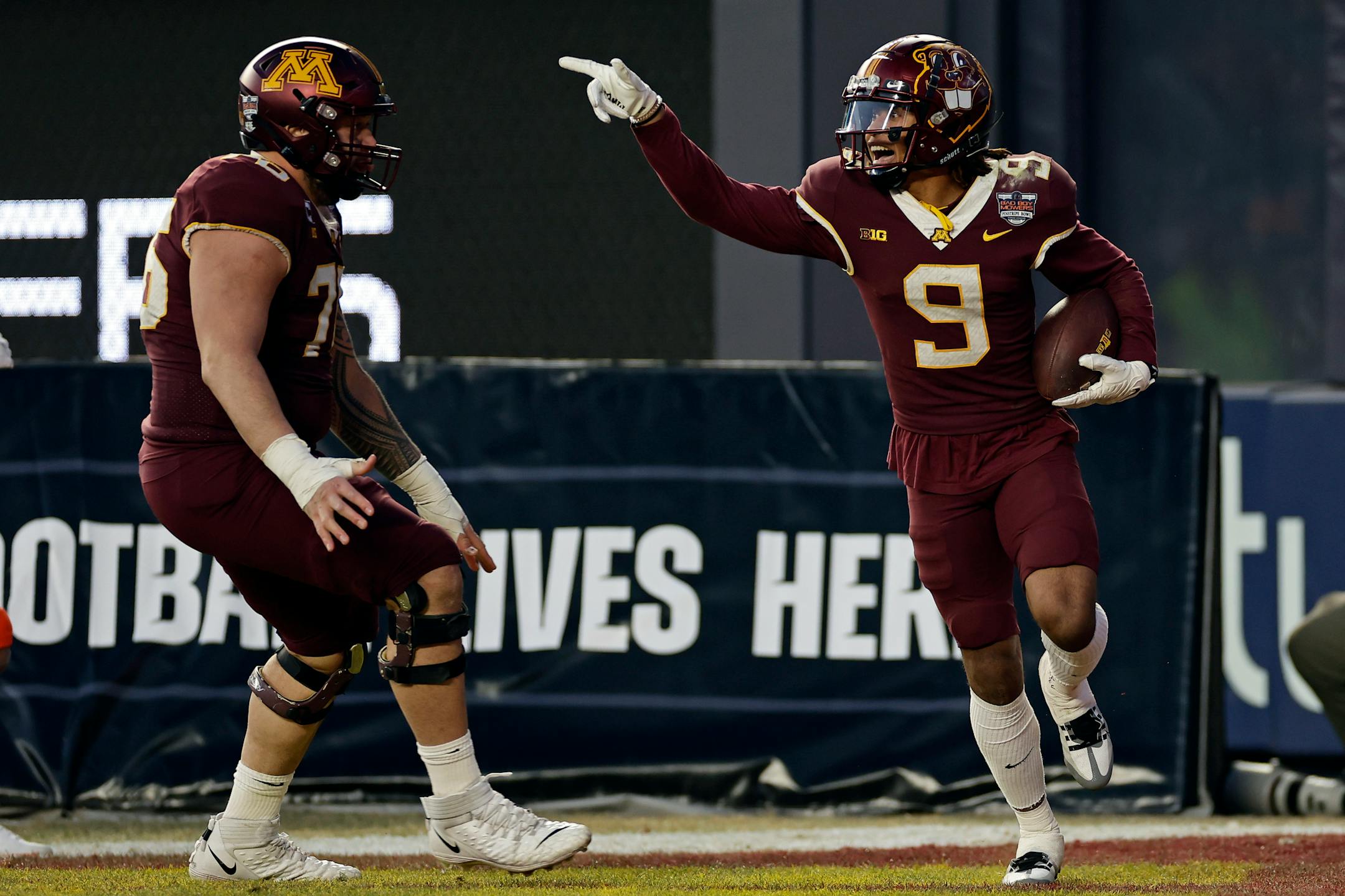 Minnesota wide receiver Daniel Jackson (9) reacts after scoring a touchdown against Syracuse during the second half.