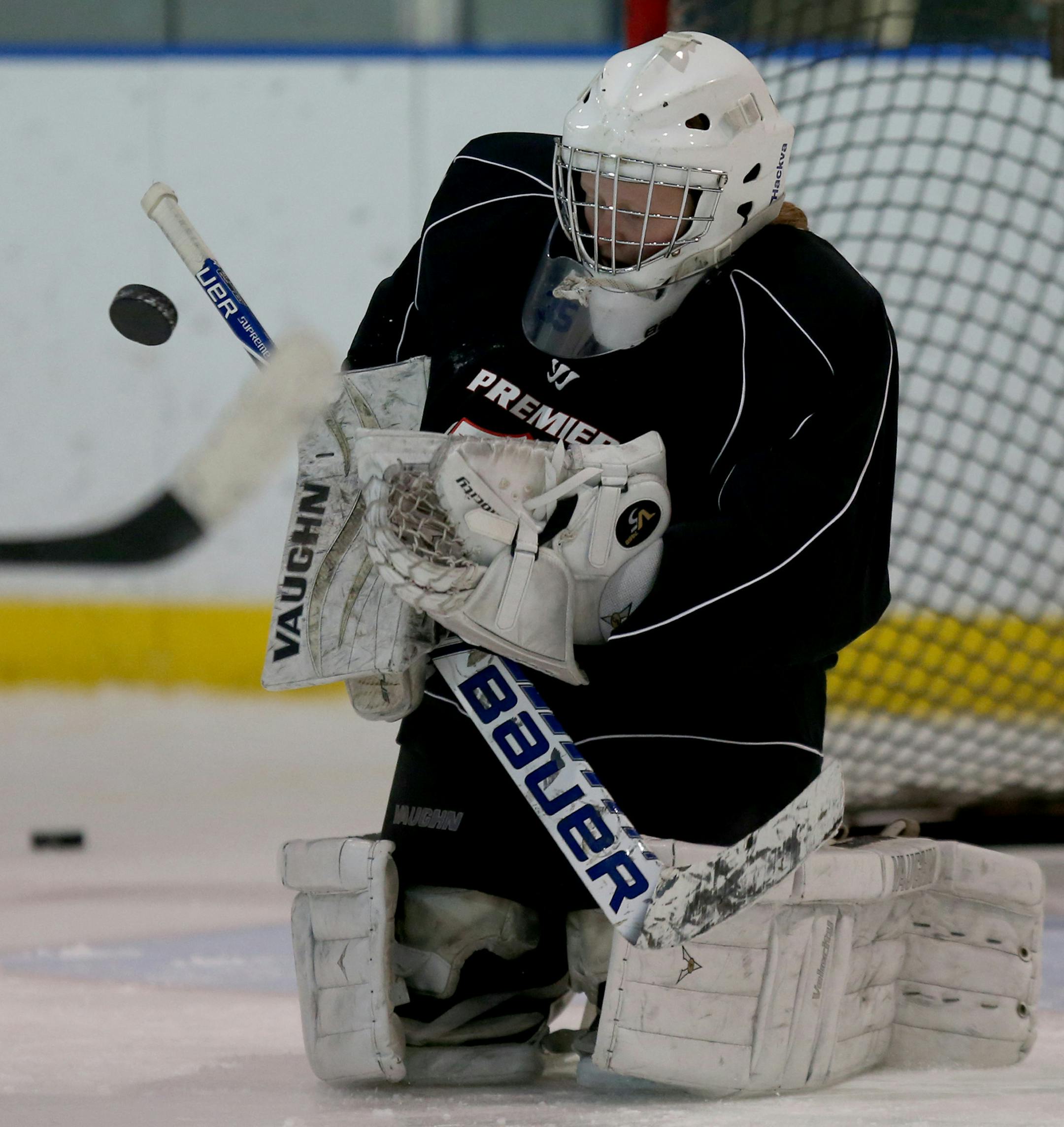 Breck goalie Jenna Brenneman blocked the shot of her teammate during practice. ] (KYNDELL HARKNESS/STAR TRIBUNE) kyndell.harkness@startribune.com During practice at Anderson Ice Arena in Golden Valley , Min., Thursday, November 20, 2014.