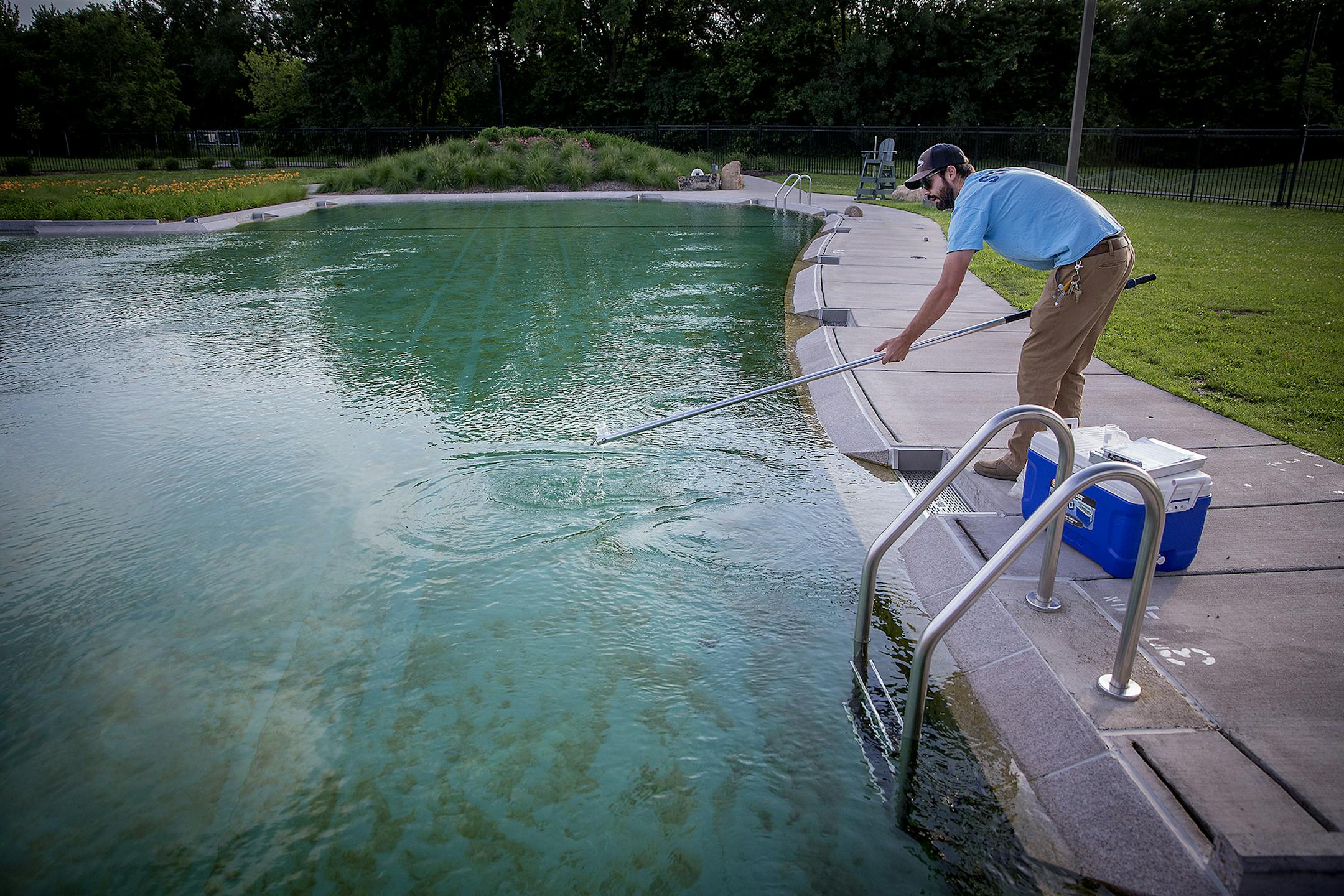 Robert Brown, a water resource specialist for the Minneapolis Park and Recreation Board, tested the water at Webber Park Pool on Thursday. Webber Pool's natural filtration system can't seem to keep the bacteria out of the water. The pool has been closed for multiple stretches this summer. The pool opened two years late and way over budget in 2015.