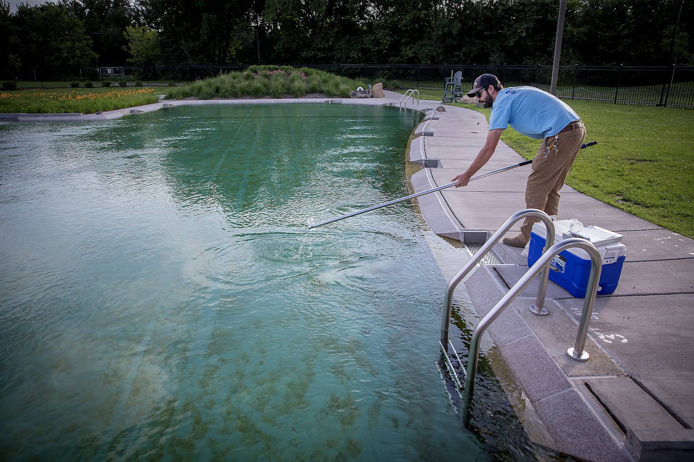 Robert Brown, a water resource specialist for the Minneapolis Park and Recreation Board, tested the water at Webber Park Pool on Thursday. Webber Pool's natural filtration system can't seem to keep the bacteria out of the water. The pool has been closed for multiple stretches this summer. The pool opened two years late and way over budget in 2015.