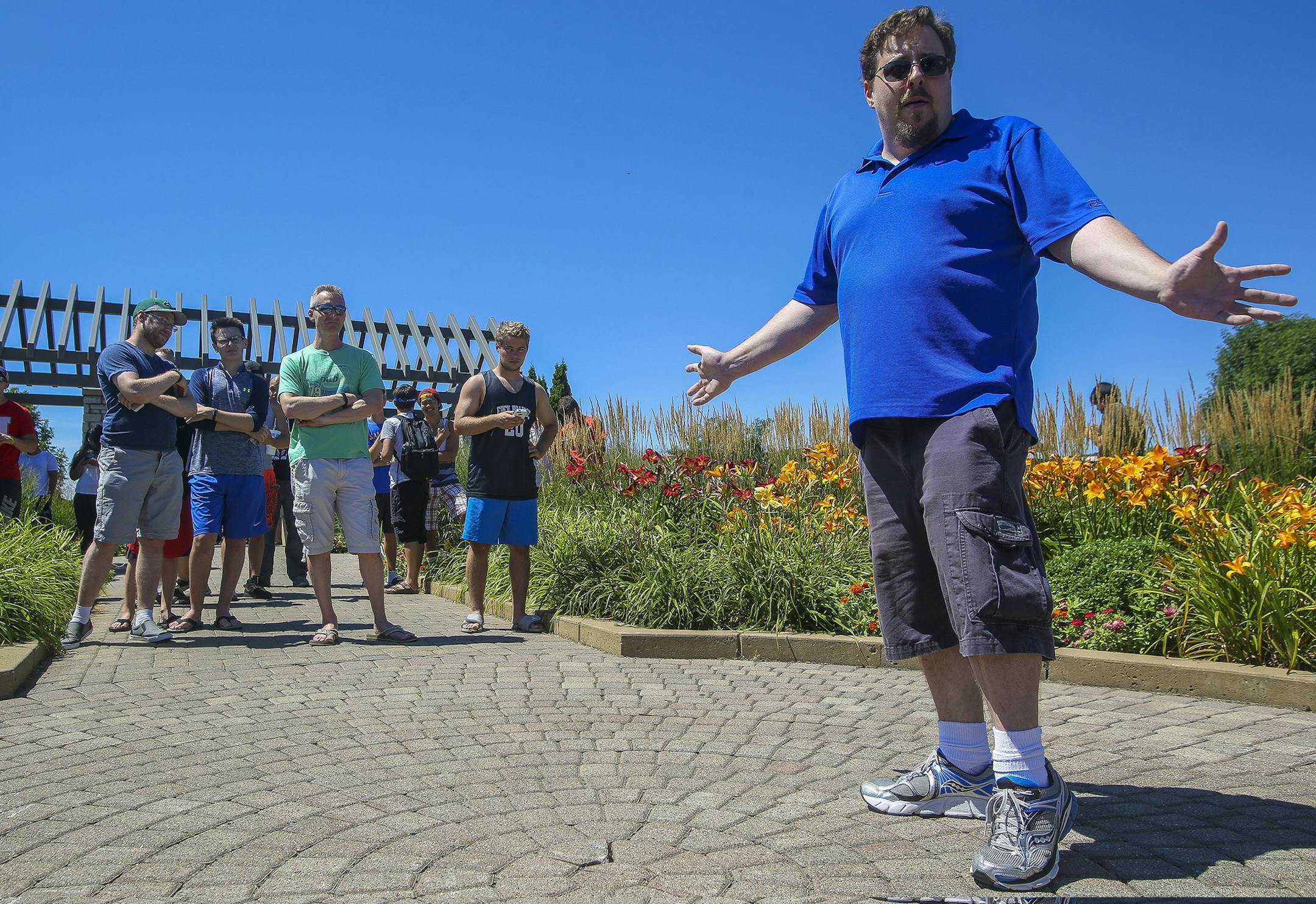 Chris Sternthal, right, speaks to Pokémon Go players after meeting with Eden Prarie City Council members on how to reduce vandalism in the parks. ] Timothy Nwachukwu • timothy.nwachukwu@startribune.com Pokémon Go trainers were out in full force in search of rare, new Pokémon at Purgatory Creek Park on Friday, July 29, 2016 in Eden Prarie. Members of Eden Prarie City council contacted Pokemon Go creators, asking them to eliminate Pokestops in the city parks, especially aroun