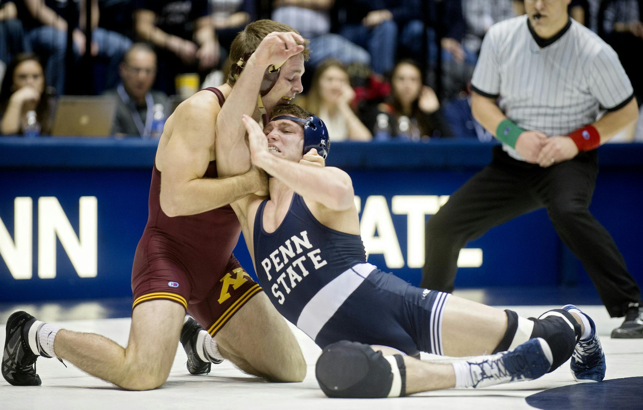 Minnesota's Nick Dardanes, left, wrestles Penn State's Kade Moss in the 141-pound bout on Sunday, Jan. 25, 2015, at Rec Hall in State College, Pa. Minnesota won the dual meet, 17-16. (Abby Drey/Centre Daily Times/TNS)
