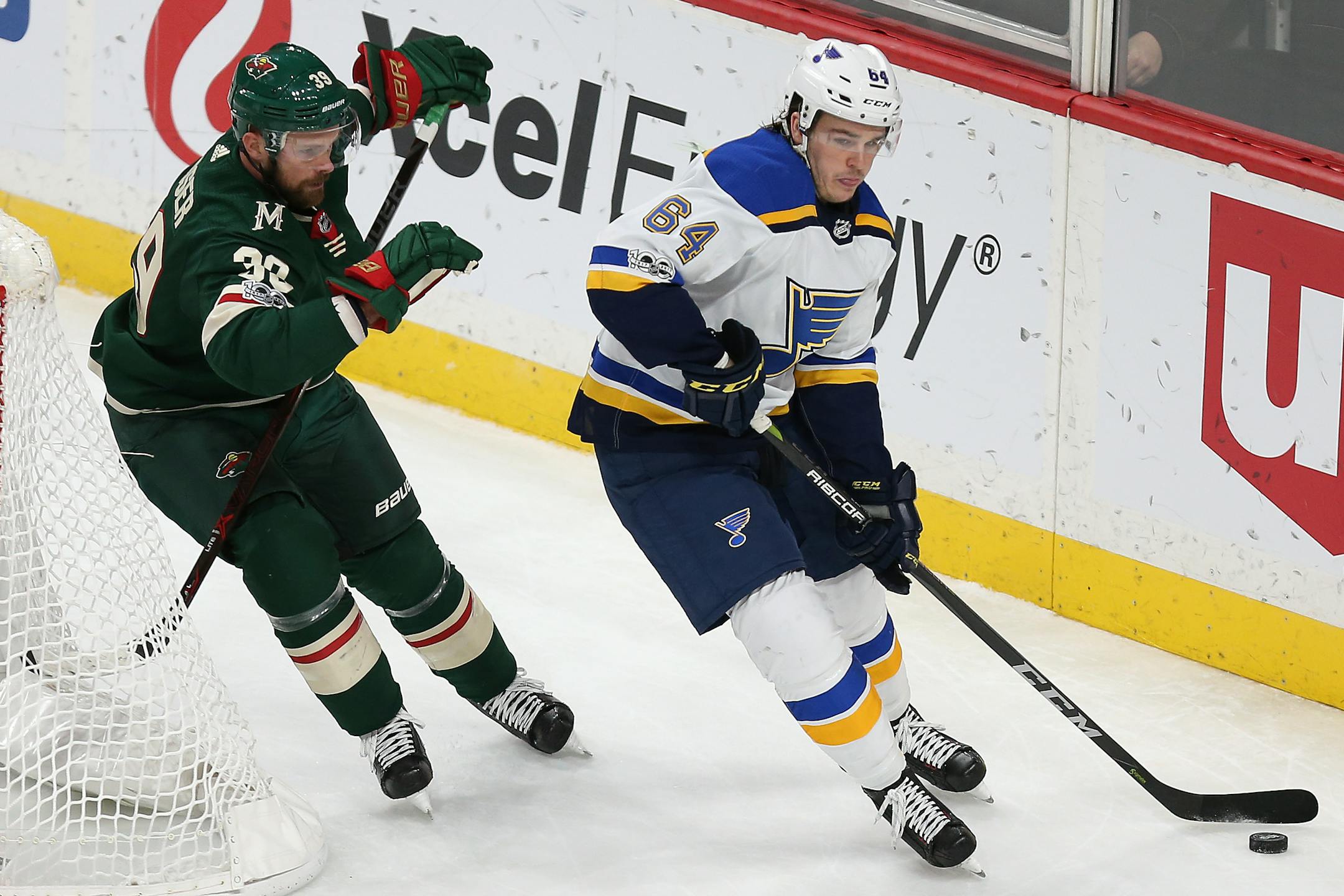 St. Louis Blues' Sammy Blais (64) controls the puck against Minnesota Wild's Nate Prosser (39) during the third period of an NHL hockey game Saturday, Dec. 2, 2017, in St. Paul, Minn. The Wild won 2-1 in overtime. (AP Photo/Stacy Bengs)