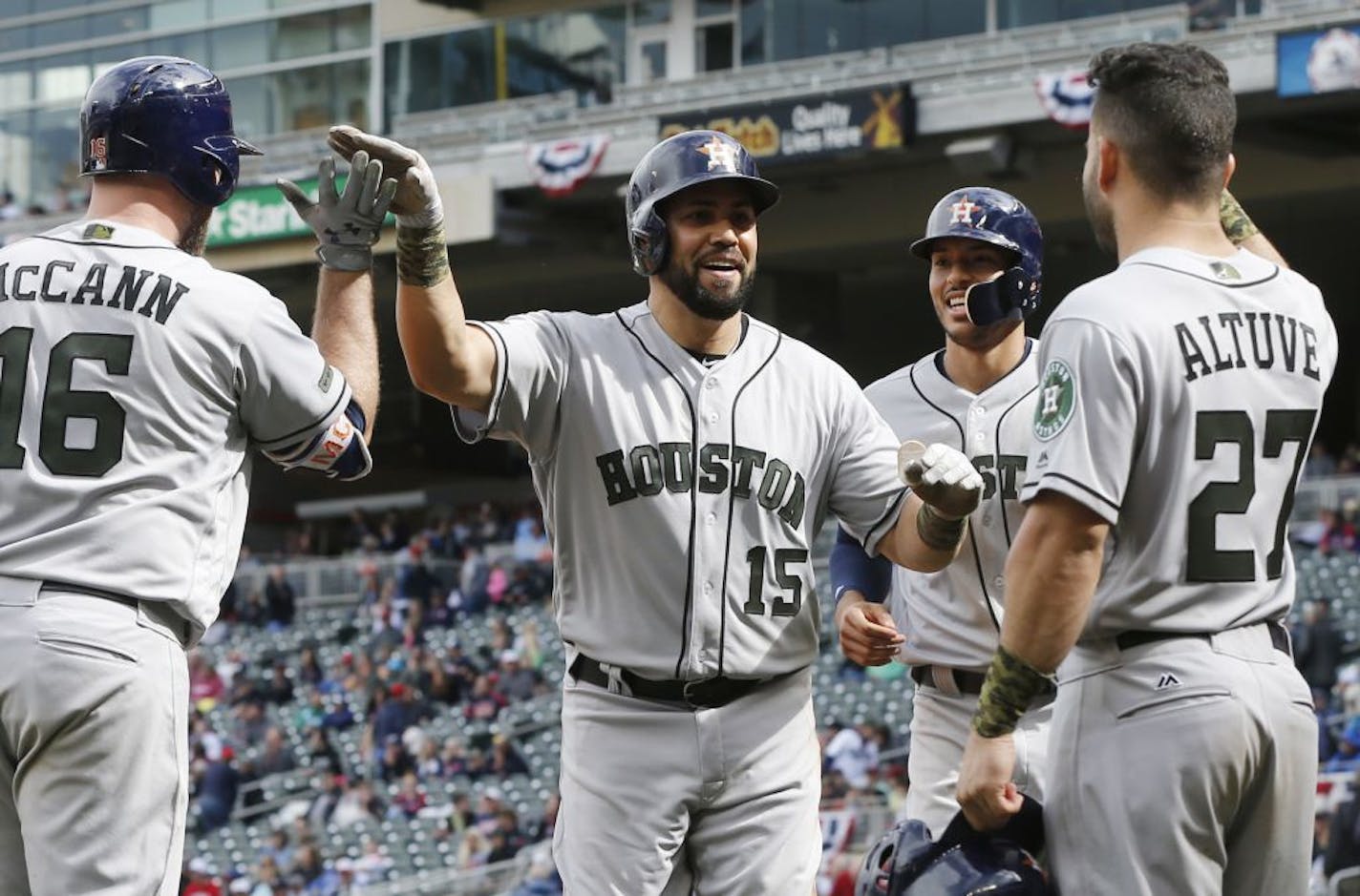 Houston Astros' Carlos Beltran, center, celebrates his three-run home run with teammates in the eighth inning of a baseball game against the Minnesota Twins Monday, May 29, 2017 in Minneapolis. The Astros won 16-8.