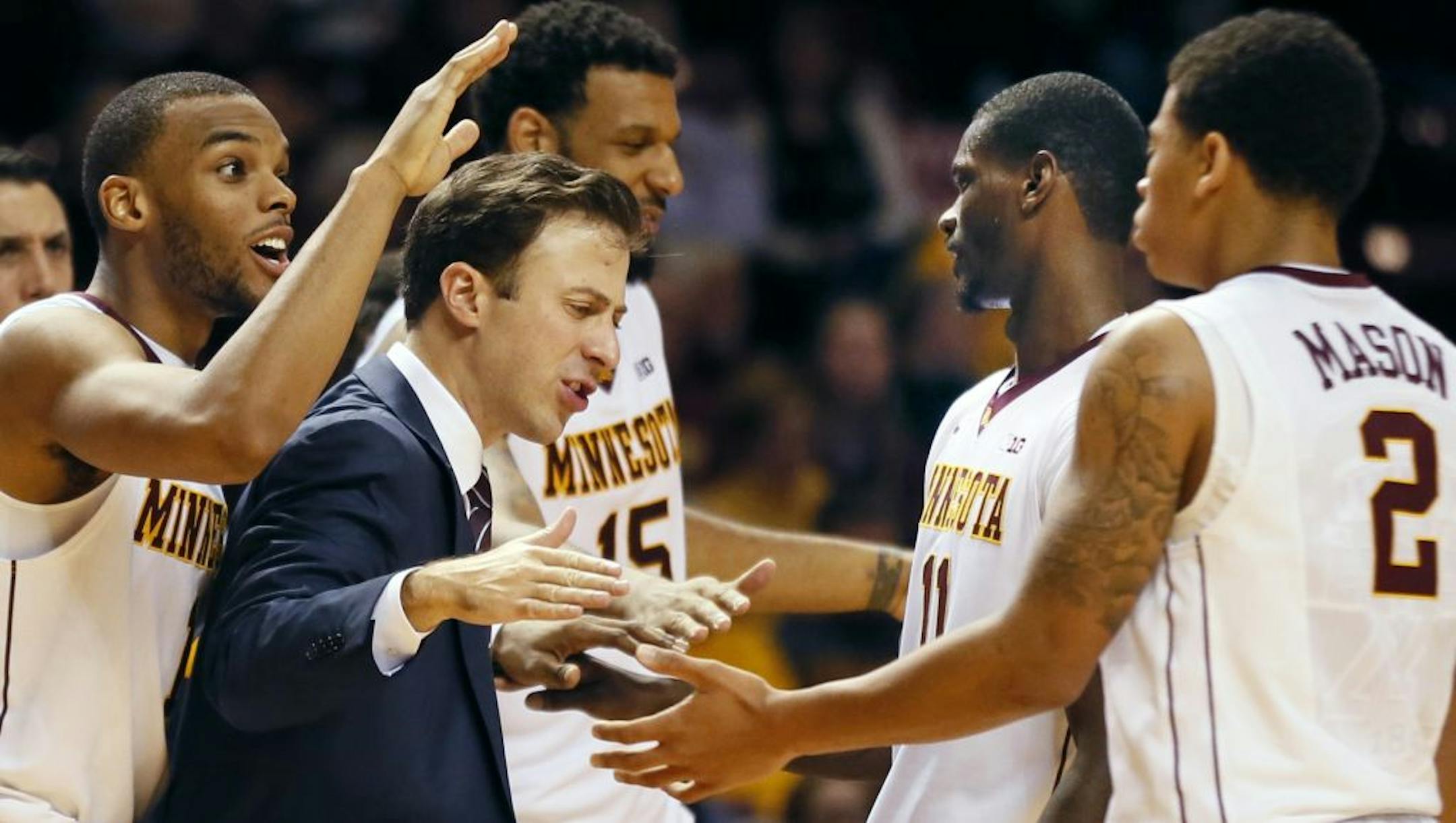 Minnesota head coach Richard Pitino talked with his team during Tuesday game at Williams Arena November 18, 2014 in Minneapolis, Minnesota.