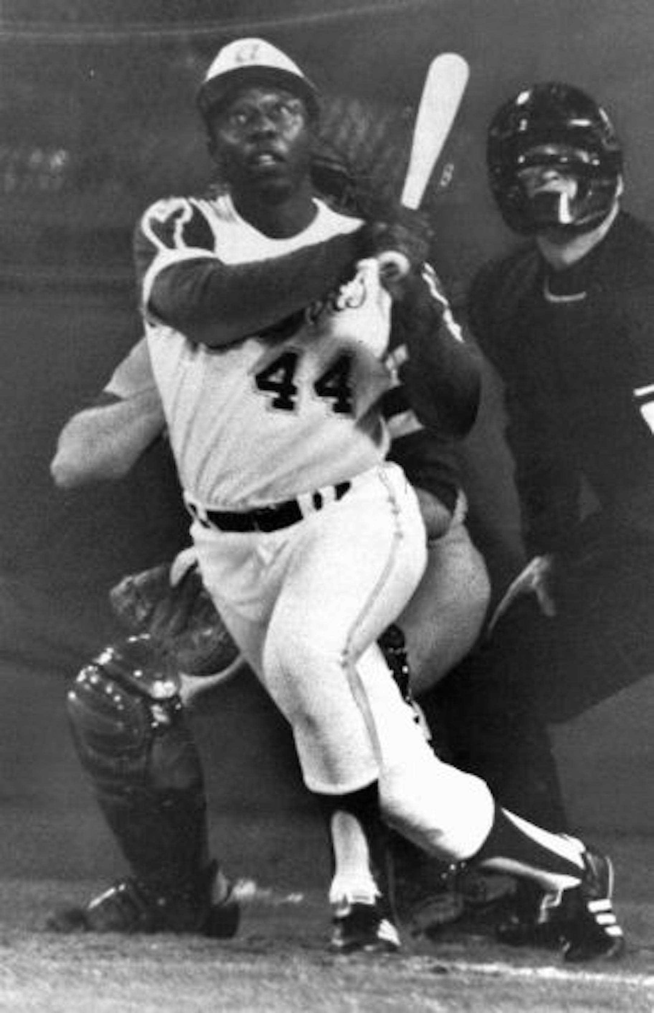 Hank Aaron, Atlanta Braves slugger, eyes the flight of the ball after hitting his 715th homer to break Babe Ruth's all-time home run record, in this April 8, 1974 photo, in Atlanta against the Los Angeles Dodgers. Hank Aaron was the antithesis of Babe Ruth. He didn't relish the spotlight like the Sultan of Swat, instead, constructing his legacy on steady, sustained, unspectacular excellence.