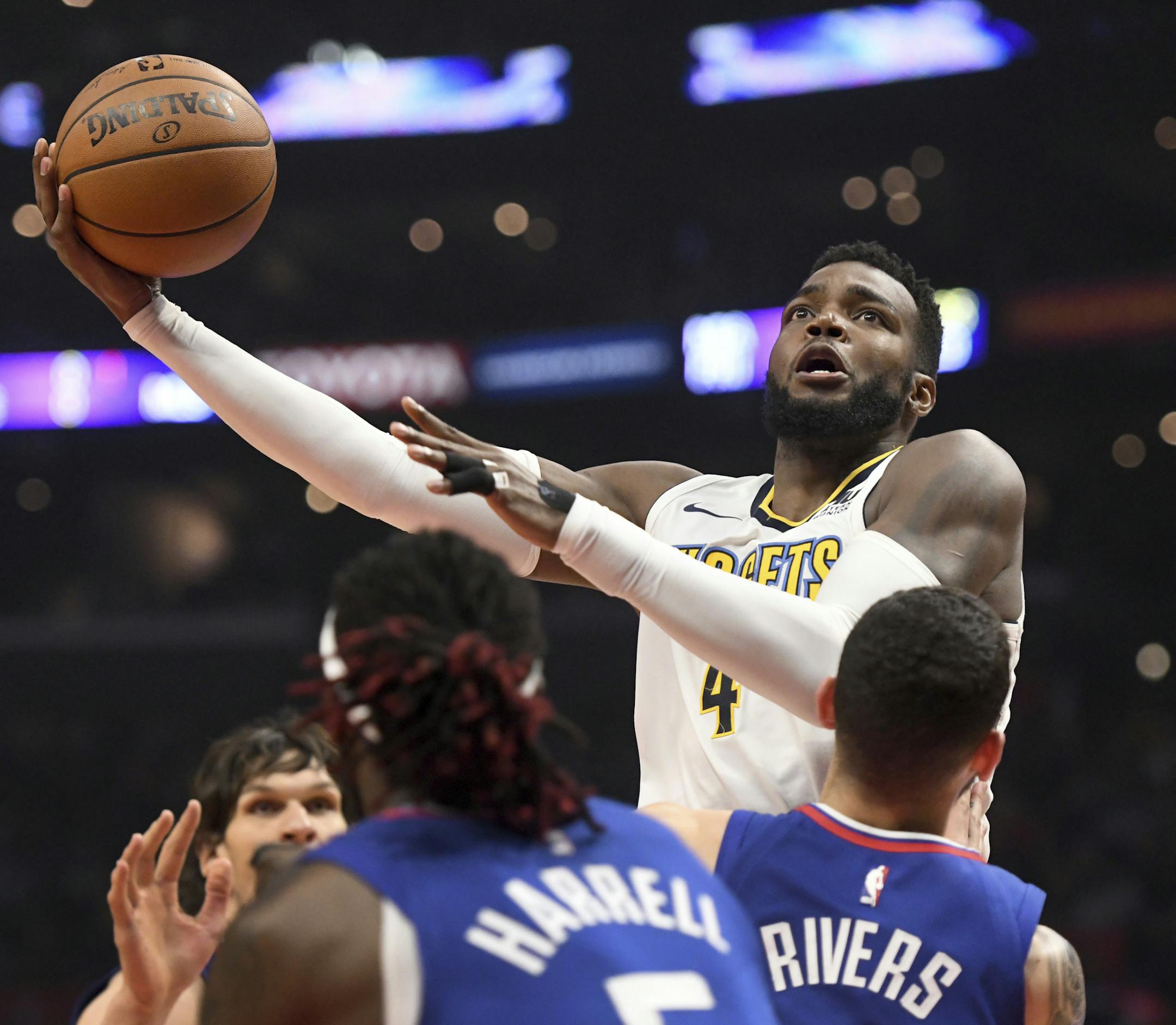 Denver Nuggets forward Paul Millsap shoots against the Los Angeles Clippers during the first half of an NBA basketball game Saturday, April 7, 2018, in Los Angeles. (AP Photo/Michael Owen Baker)