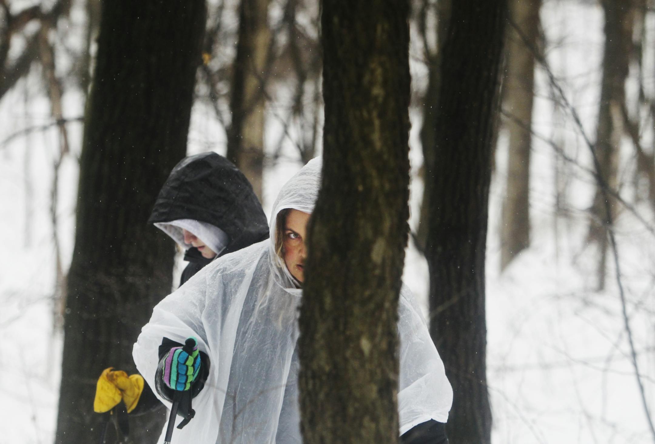 Jen McCutcheon of Lakeville, front, and her daughter Kayla, 16, searched a hill in Spring Lake Reserve, along the Mississippi River, for the body of Kira Trevino Saturday, March 9, 2013 in Rosemount, MN. McCutcheon said she and her daughter just hoped to "help the family find her."