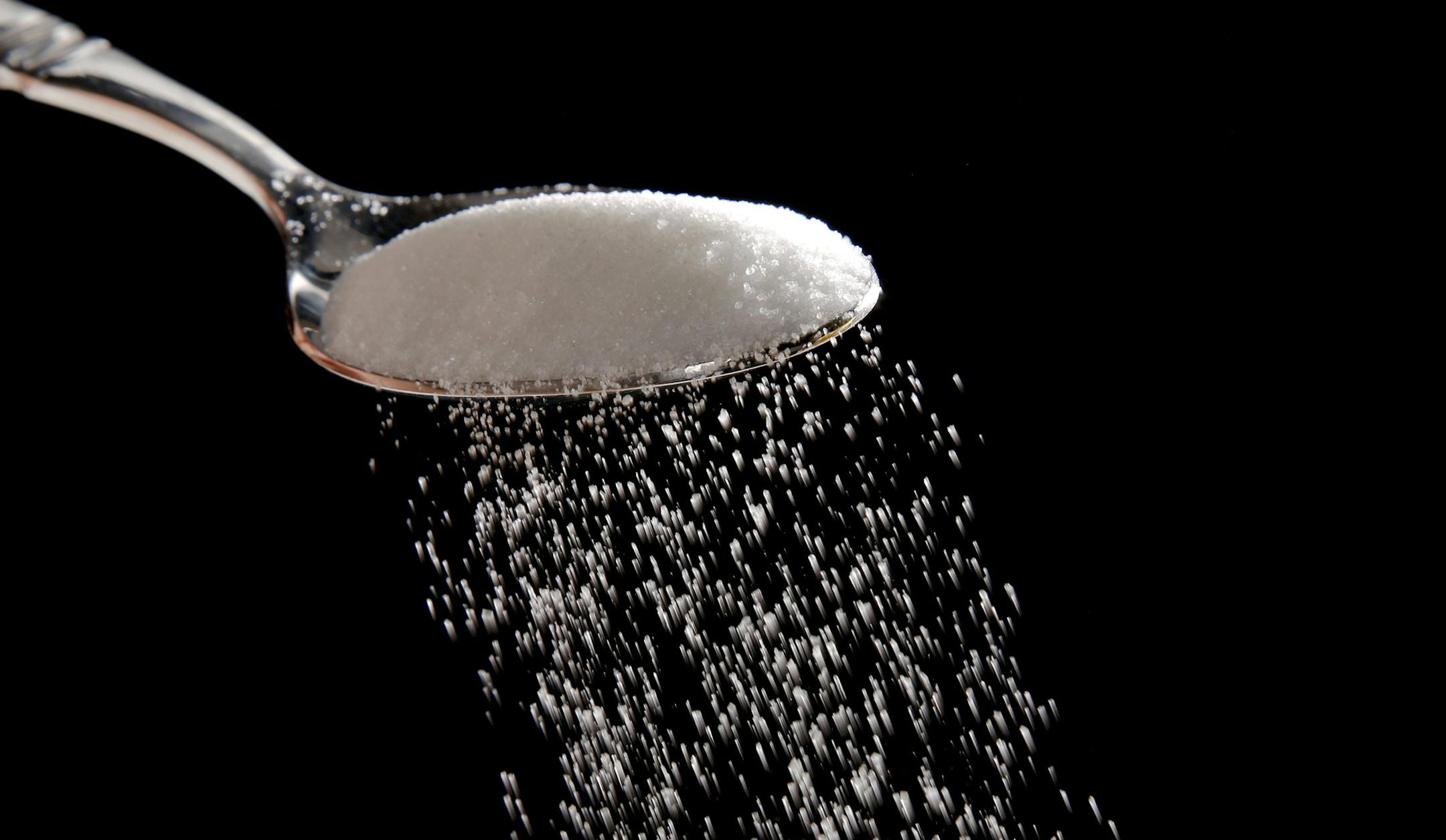 Granulated sugar is poured in Philadelphia, Monday, Sept. 12, 2016. A new study released Monday details how the sugar industry worked to downplay emerging science linking sugar and heart disease. It's the latest installment of an ongoing project by a former dentist to reveal the industry's decades-long attempt to influence science. The Sugar Association said it questions the author's attempt to play into current anti-sugar sentiment. (AP Photo/Matt Rourke) ORG XMIT: MIN2016091312485817