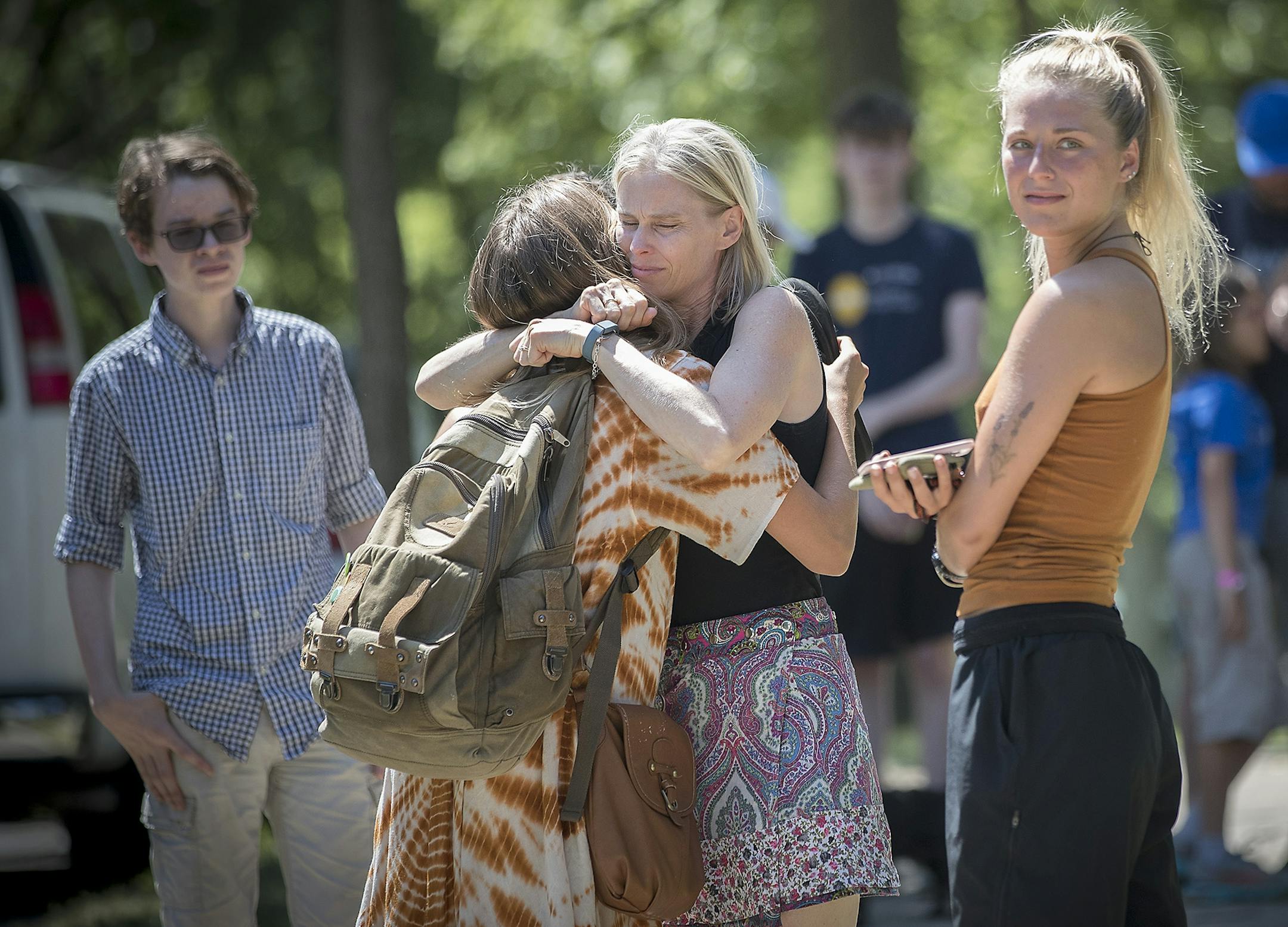 Melinda Barry comforted friends of Justine Damond near her home and the scene where a Minneapolis police officer shot and killed Justine Damond, Monday, July 17, 2017 in Minneapolis, MN.