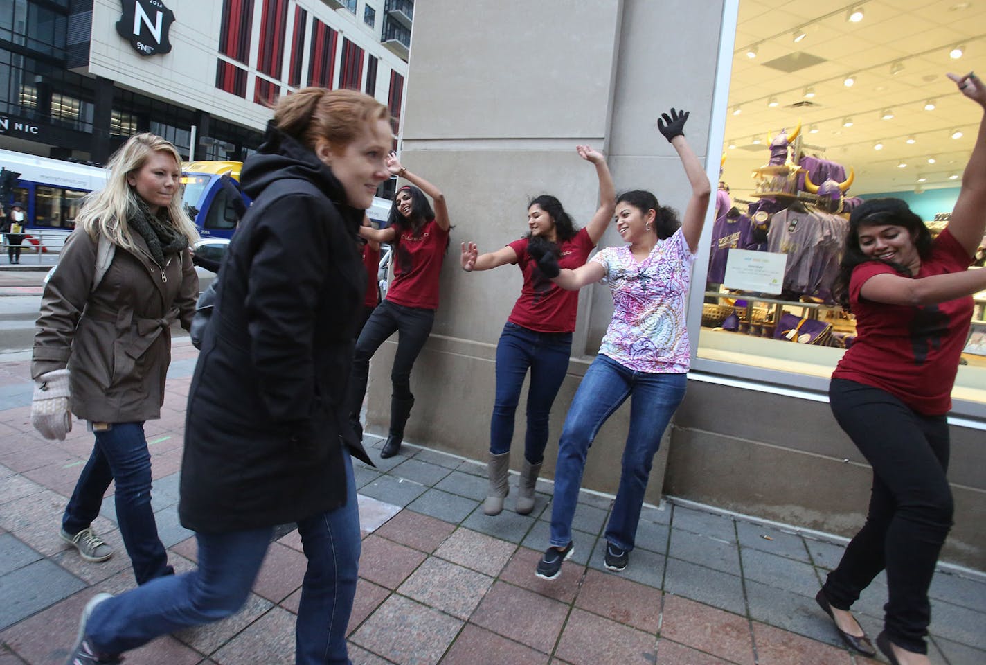 About a dozen dancers from Bollywood Dance Scene showed off their moves to commuters in Minneapolis near the light-rail stop at Nicollet Mall on Thursday as part of Give to the Max Day.