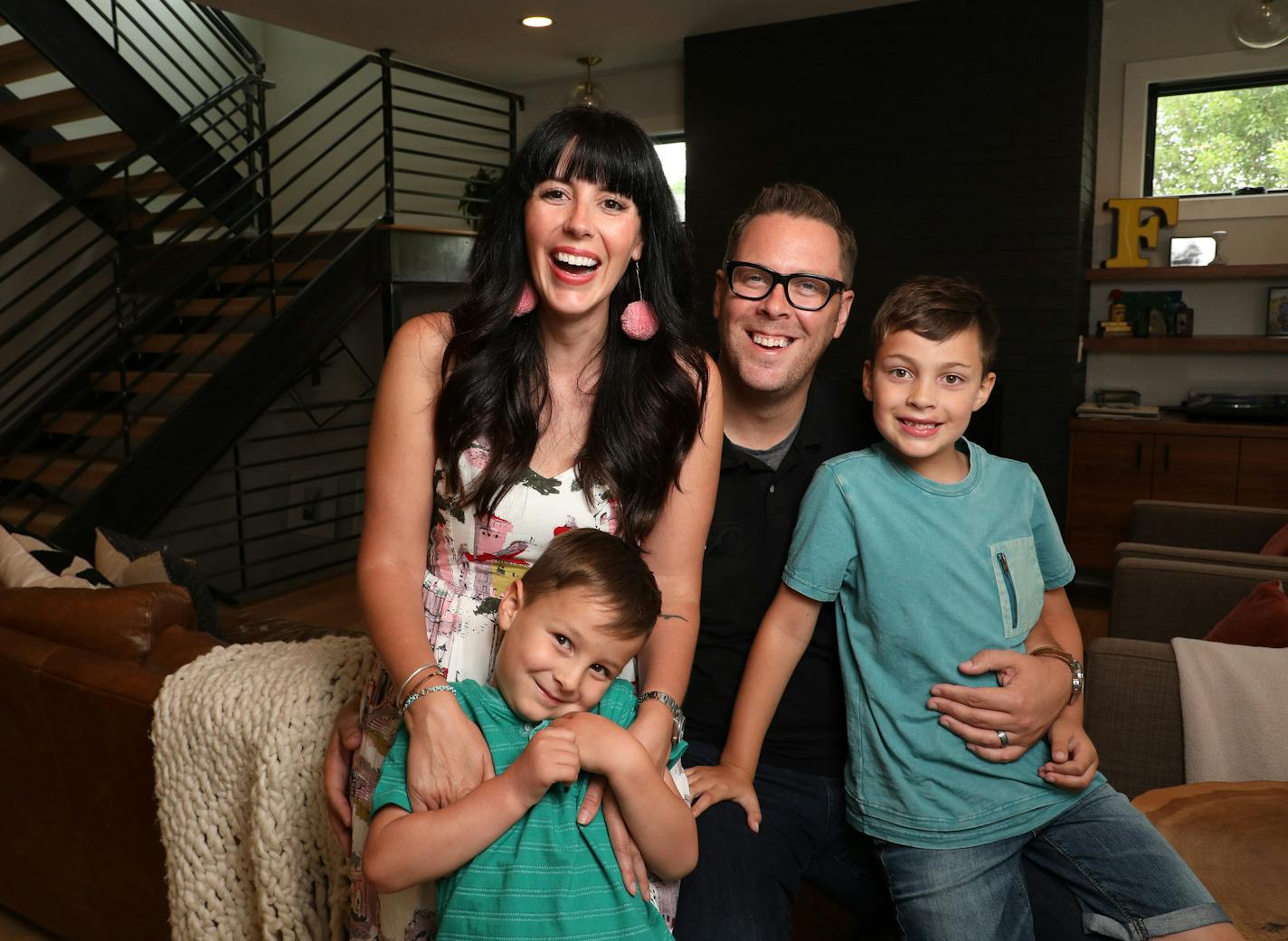 Heather and Brad Fox at home in Edina with their sons, Wesley and Graham.