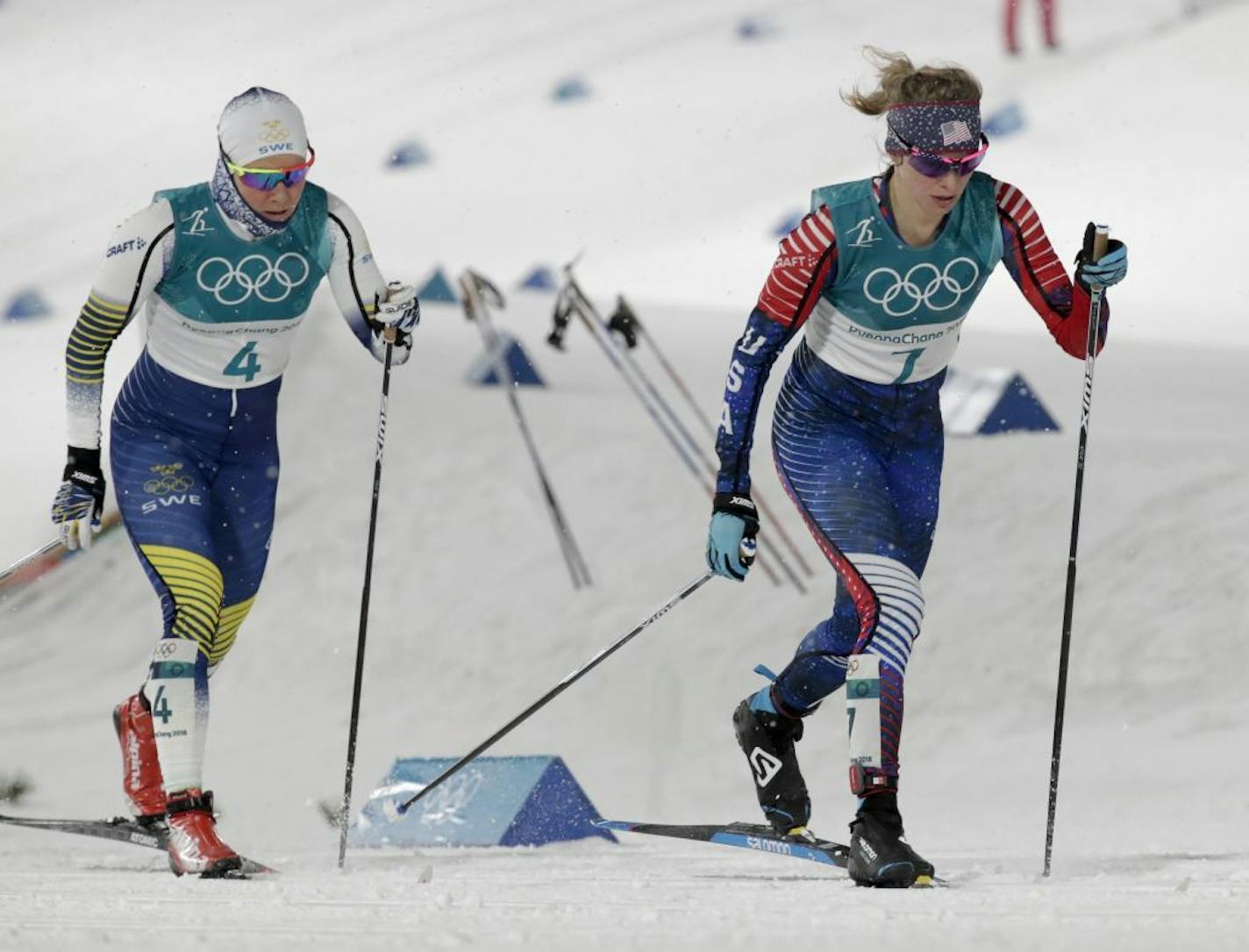 Jessica Diggins, right, of the United States, competes during the women's cross-country skiing sprint classic at the 2018 Winter Olympics in Pyeongchang, South Korea, Tuesday, Feb. 13, 2018.