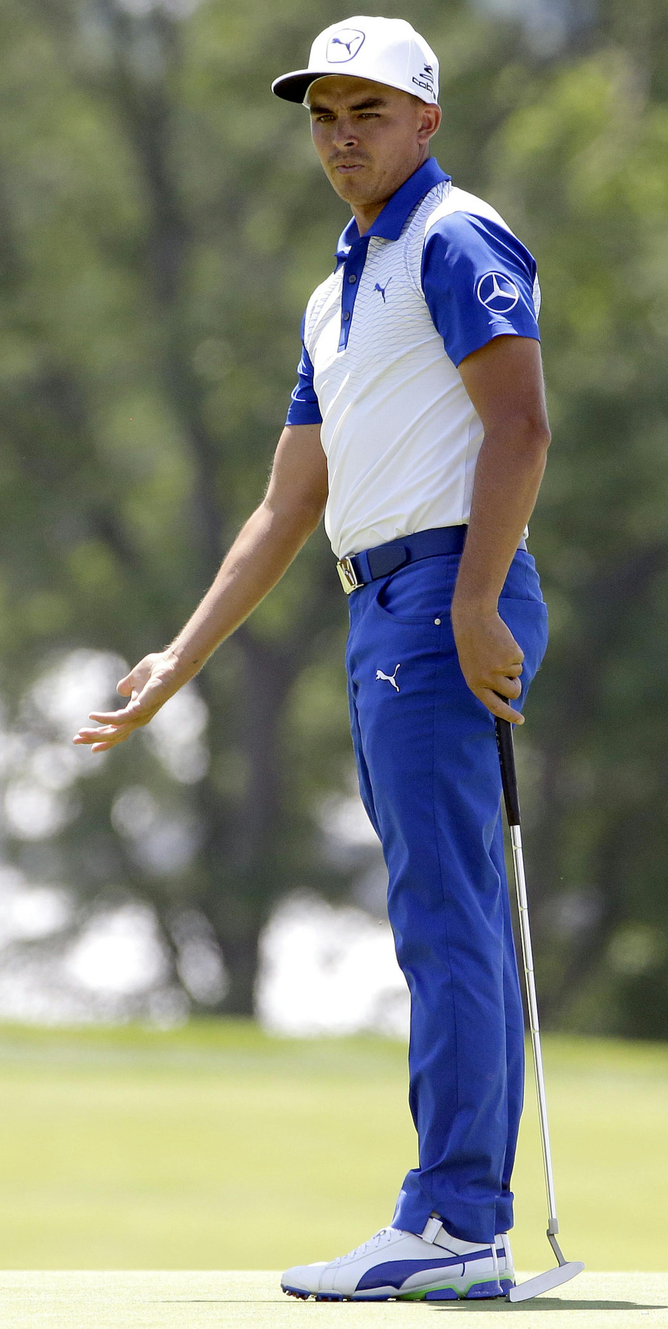 Rickie Fowler reacts to his putt on the third hole during the rain delayed second round of the U.S. Open golf championship at Oakmont Country Club on Saturday, June 18, 2016, in Oakmont, Pa. (AP Photo/Gene J. Puskar)