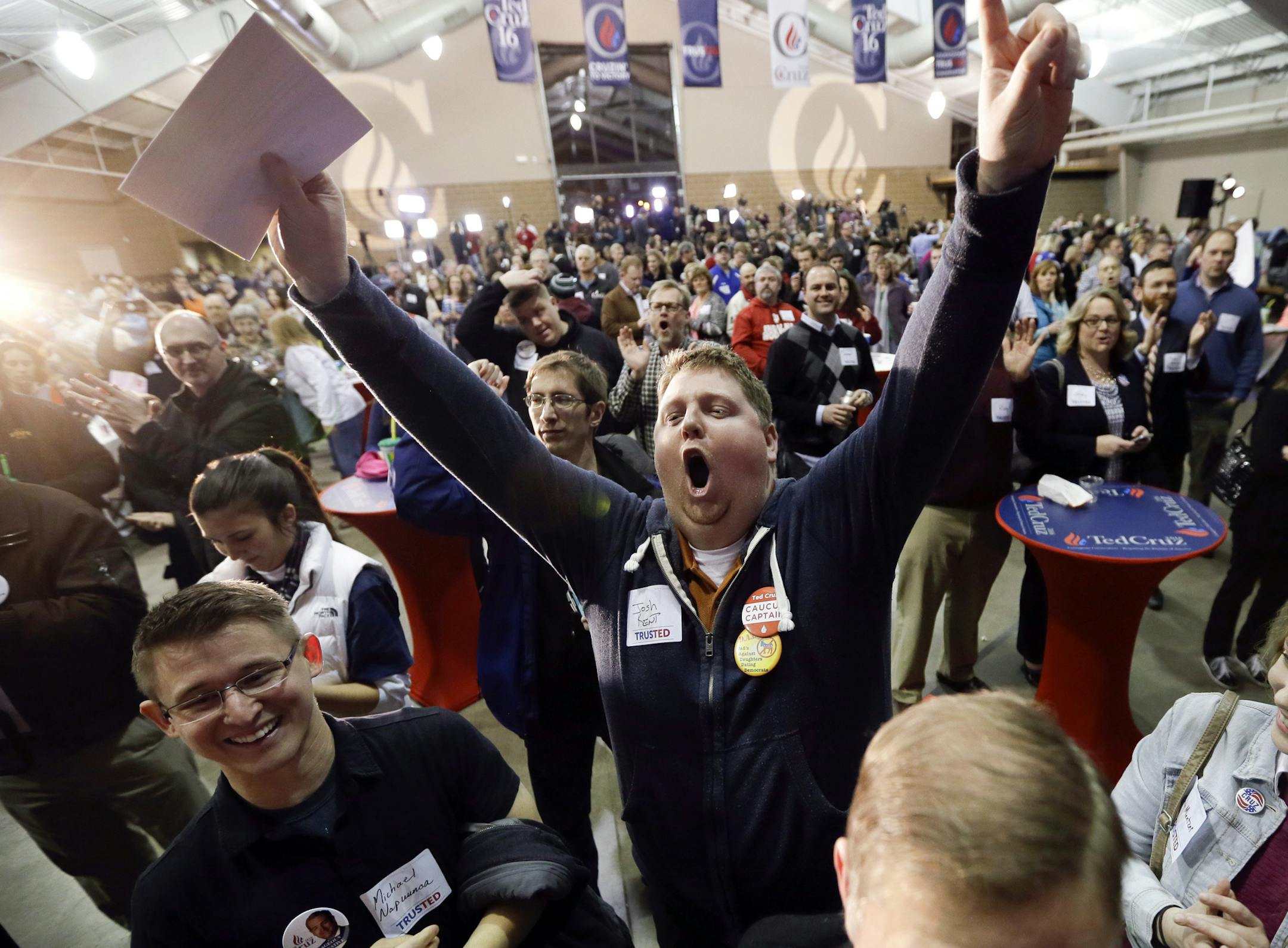 Josh Kent celebrates at Republican presidential candidate, Sen. Ted Cruz, R-Texas, caucus night rally, Monday, Feb. 1, 2016, in Des Moines, Iowa. (AP Photo/Charlie Neibergall) ORG XMIT: MIN2016020121372856