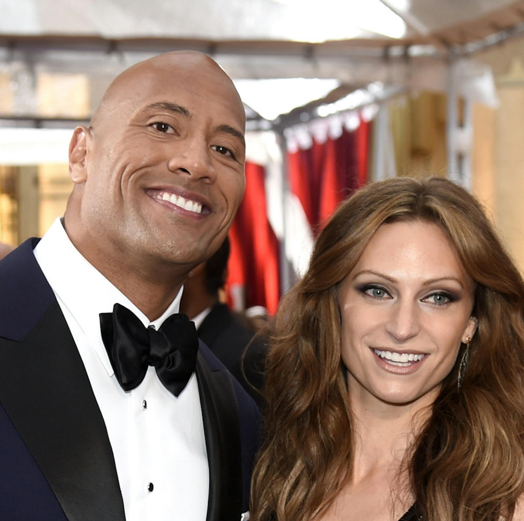 FILE - In this Feb. 22, 2015, file photo Dwayne Johnson, left, and Lauren Hashian arrive at the Oscars at the Dolby Theatre in Los Angeles. Johnson announced his wedding to Hashian on Instagram. A photo of the couple was posted on the social media site, showing them both wearing white. The post also said the date of their apparent nuptials, on Sunday, Aug. 18, 2019, in his native Hawaii. (Photo by Chris Pizzello/Invision/AP, File)