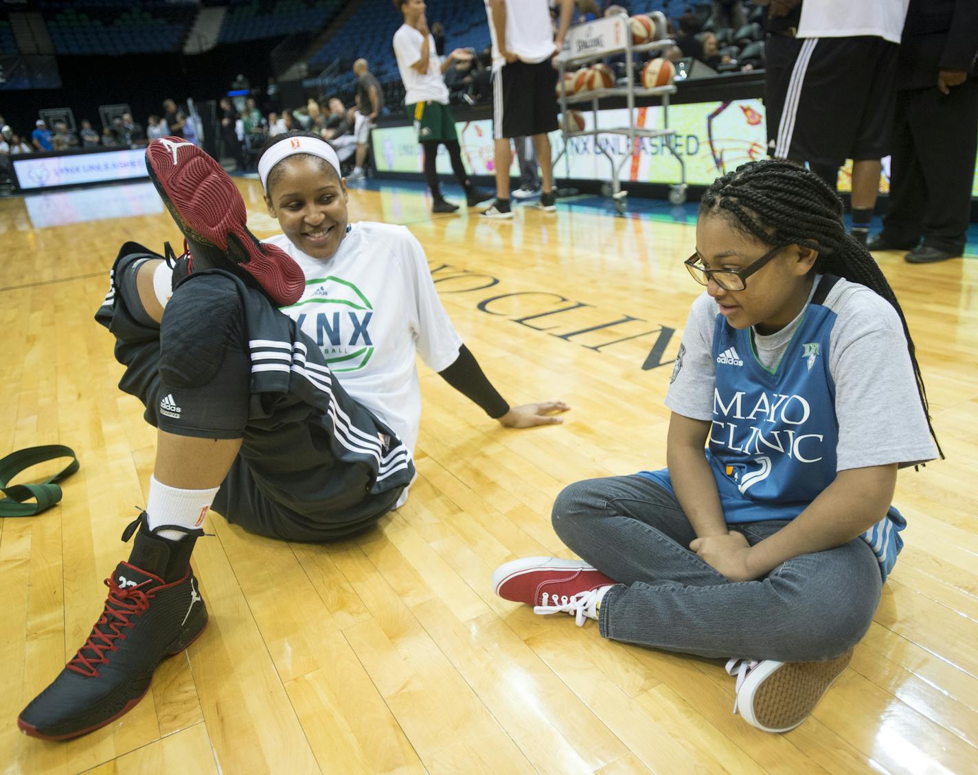 Ariya Smith, a 14-year-old from Colorado, had some one-on-one time with Lynx star Maya Moore as she stretched before Thursday night's game against Seattle. Smith is suffering from systemic lupus and is visiting Moore and the Lynx with the Make-A-Wish Foundation. Smith was introduced as a starter with the team and had the chance to join the team on the bench during Thursday night's game. ] Aaron Lavinsky &#xef; aaron.lavinsky@startribune.com The Minnesota Lynx play the Seattle Storm on Thursday,