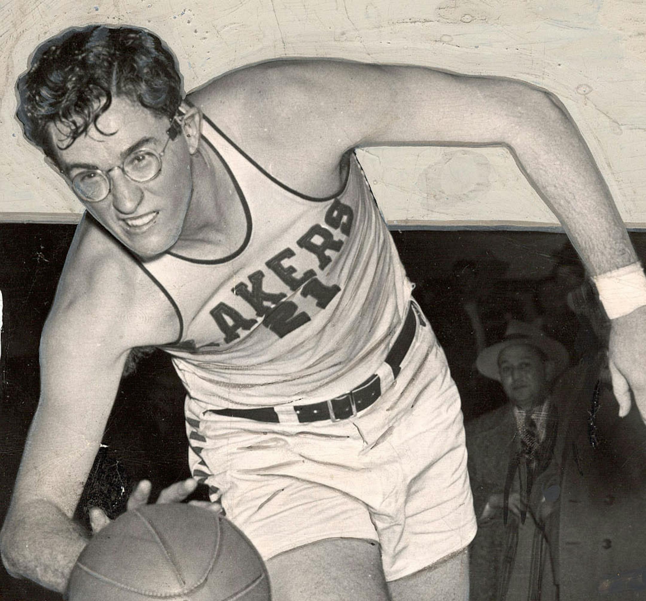 ** FILE ** George Mikan is seen during his playing days with the Minneapolis Lakers in a 1948 file photo. When Mikan died Wednesday night at a Scottsdale rehabilitation center, 18 days shy of his 81st birthday, he was remembered as a towering figure who literally transformed the game. He became the sport's first big star, a man whose popularity and talent nurtured the fledgling pro game until the likes of Bill Russell, Bob Cousy and Wilt Chamberlain arrived. (AP Photo/Chicago Sun-Times, File)