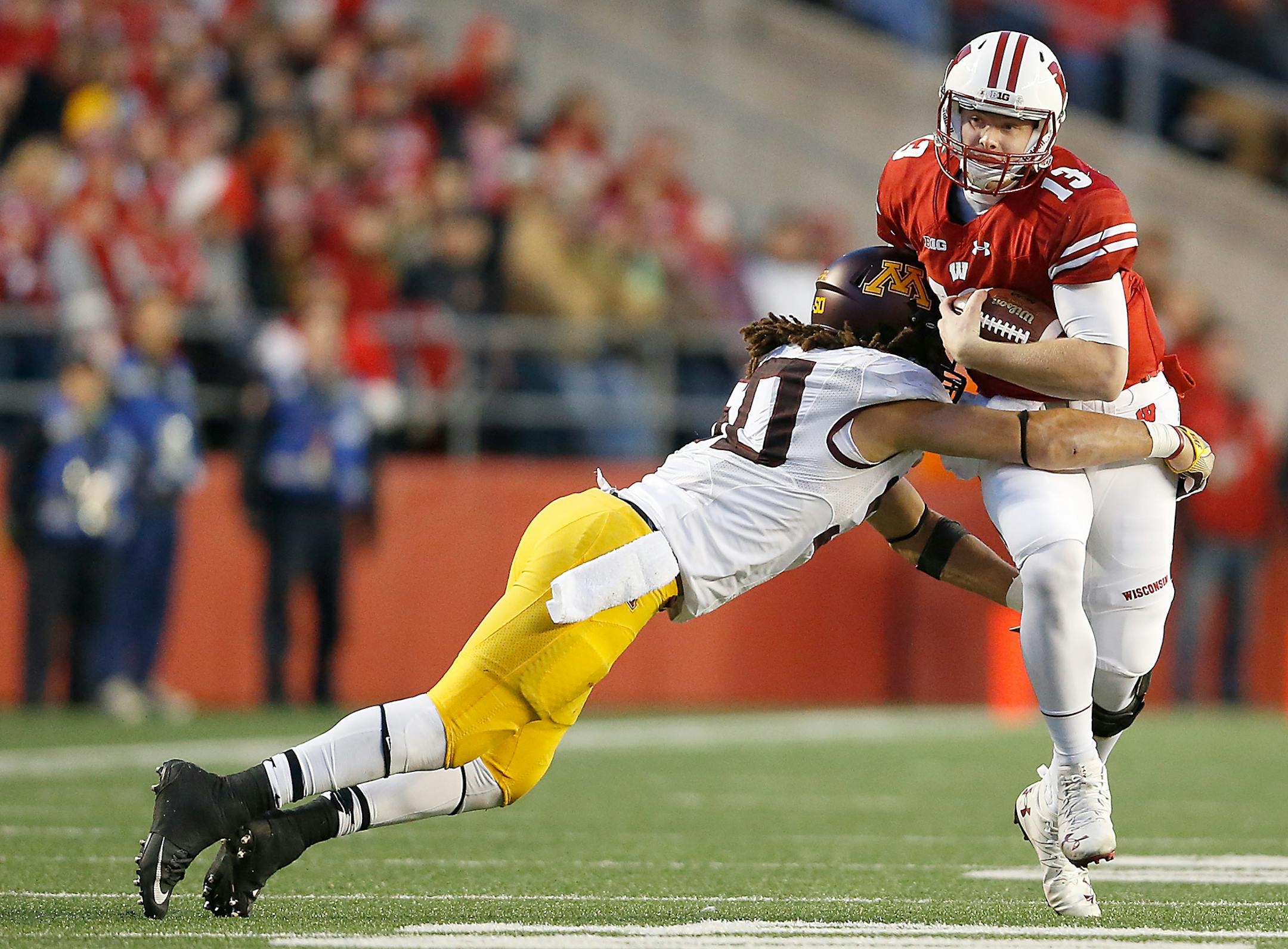 Gophers linebacker Jack Lynn tackled Wisconsin quarterback Bart Houston in the third quarter Saturday.