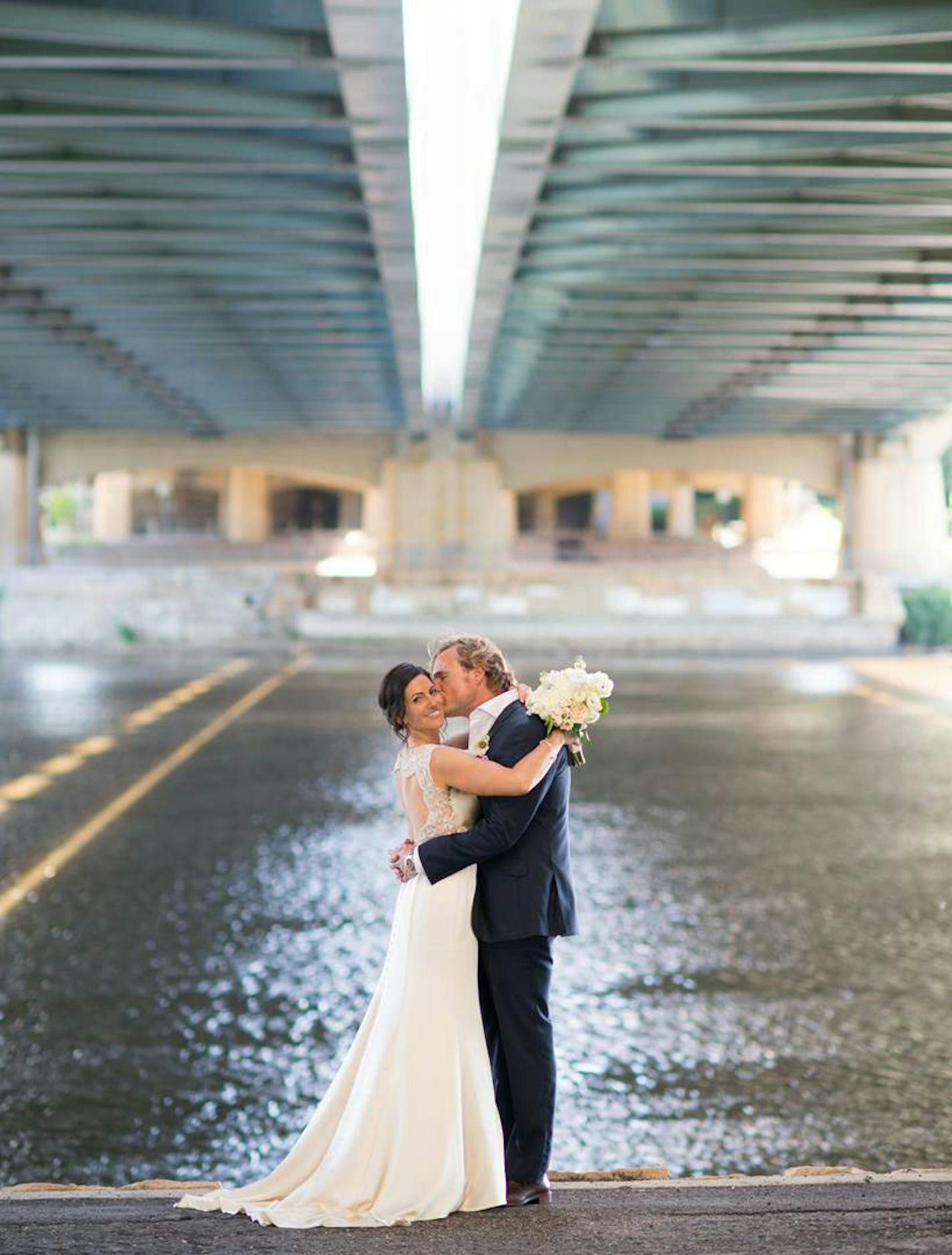 Rena and Scott were photographed under the Hennepin Avenue Bridge in Minneapolis. "I just wanted to go down by the river because I love the river so much," said Sarigianopoulos.