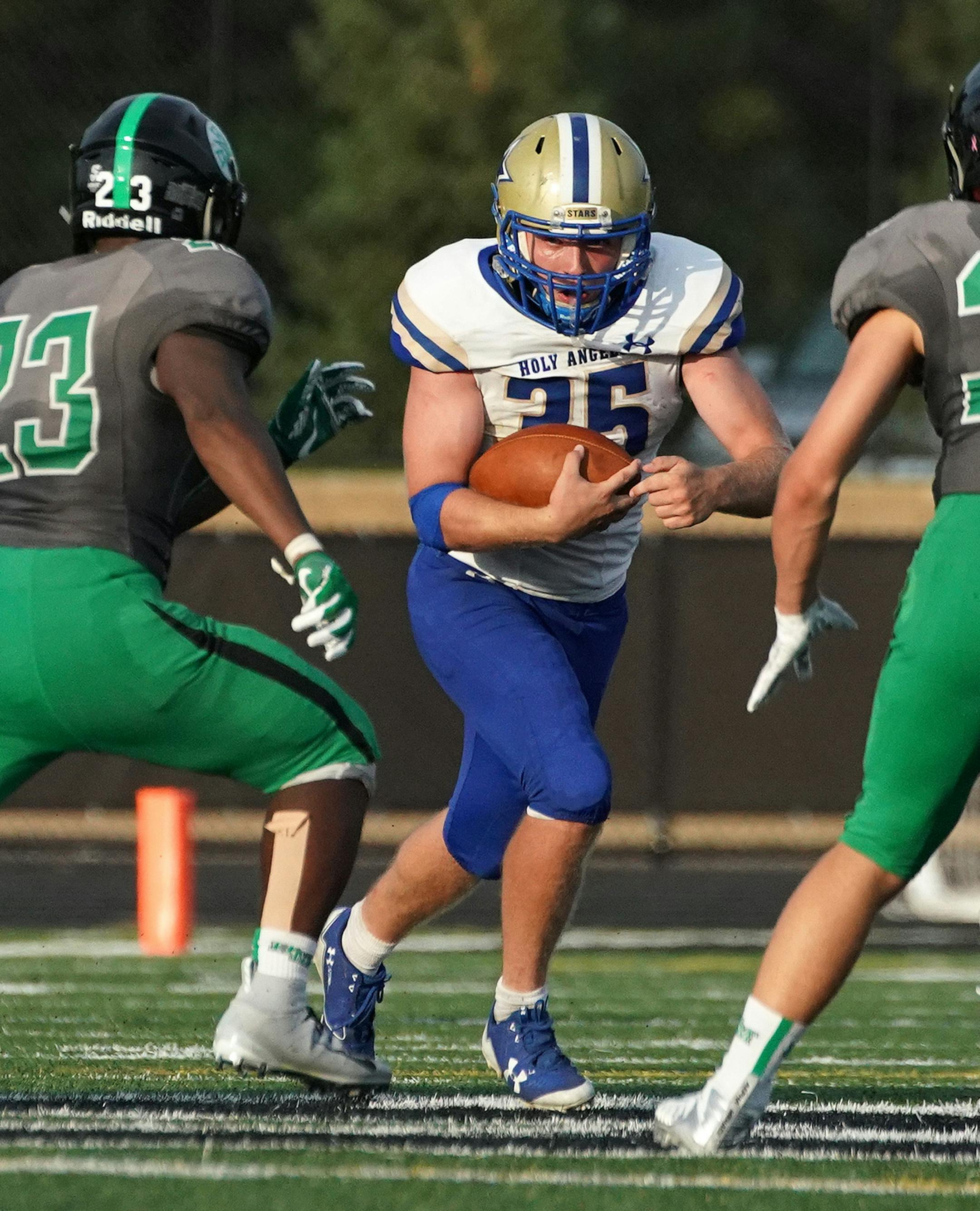 Academy of Holy Angels halfback Alex Knoll (35) tried to carry the ball through the Hill-Murray School defense in the second half. ] ANTHONY SOUFFLE ï anthony.souffle@startribune.com The Hill-Murray School played the Academy of Holy Angels in a MSHSL football game Friday, Aug. 31, 2018 at the Hill-Murray School in Maplewood, Minn.