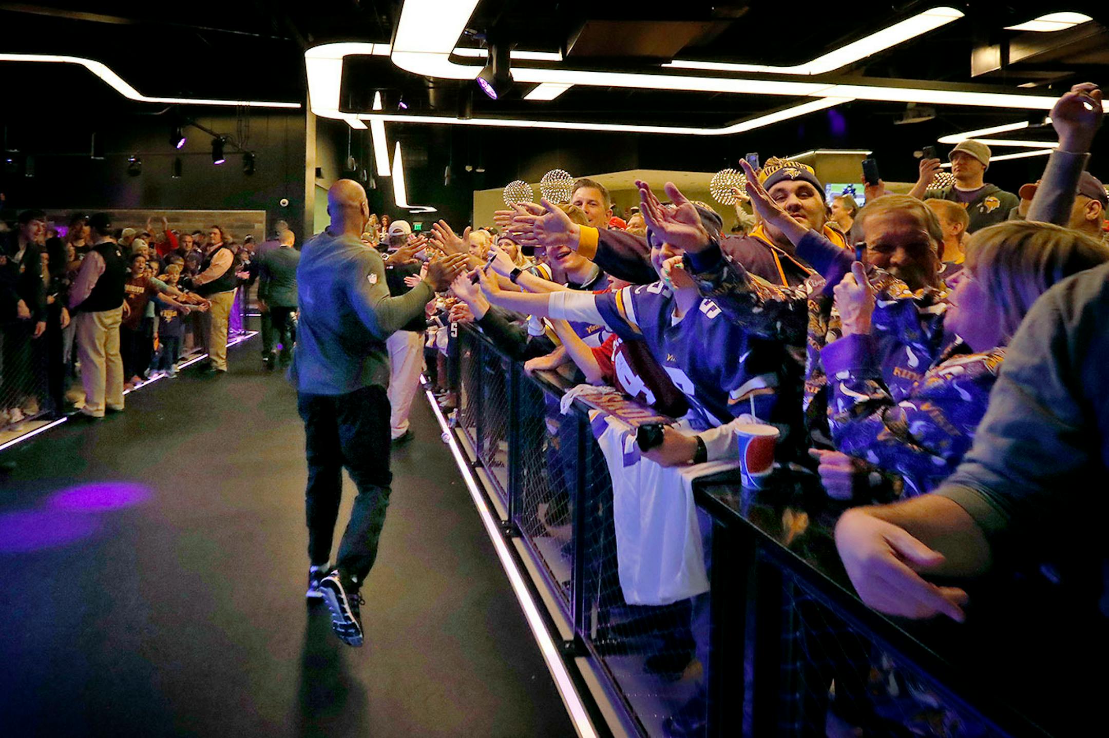 Minnesota Vikings running back Adrian Peterson was greeted by fans as he walked back to the locker room at the end of the game.