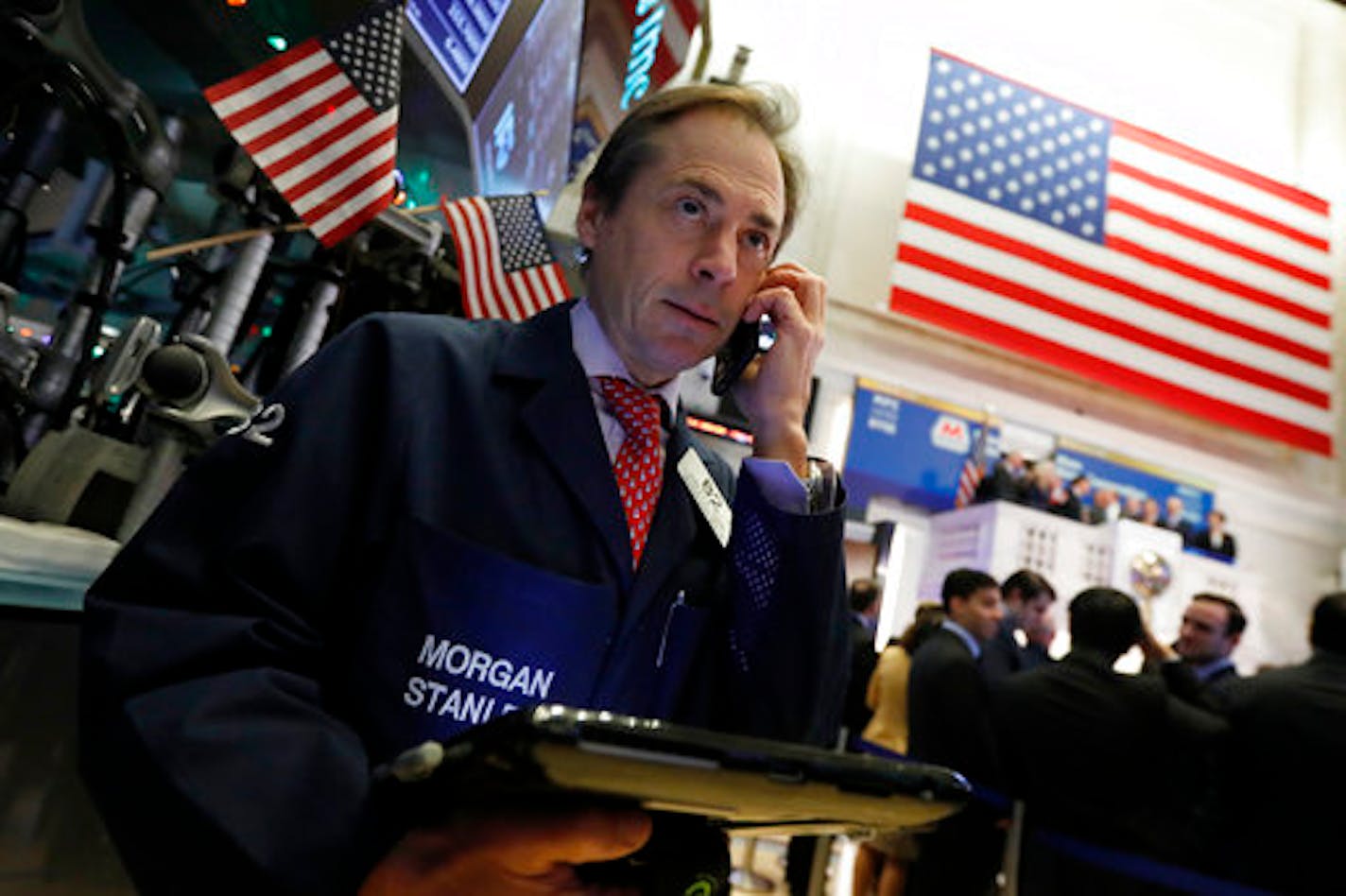 Trader Dudley Devine works on the floor of the New York Stock Exchange, Monday, Dec. 3, 2018. Stocks are opening sharply higher on Wall Street, following gains in overseas markets after the U.S. and China struck a 90-day truce in their trade dispute. (AP Photo/Richard Drew)