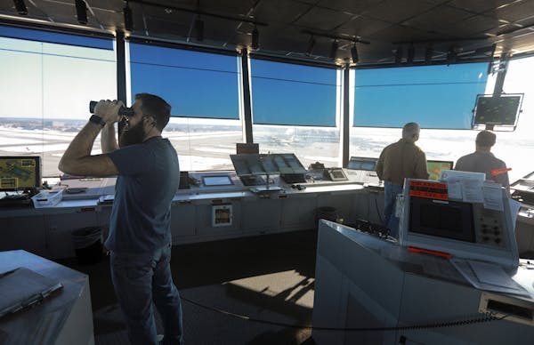 Air traffic controllers work the tower at MSP. ] The Minneapolis-St. Paul International Airport anticipates a record number of air travelers will fly 