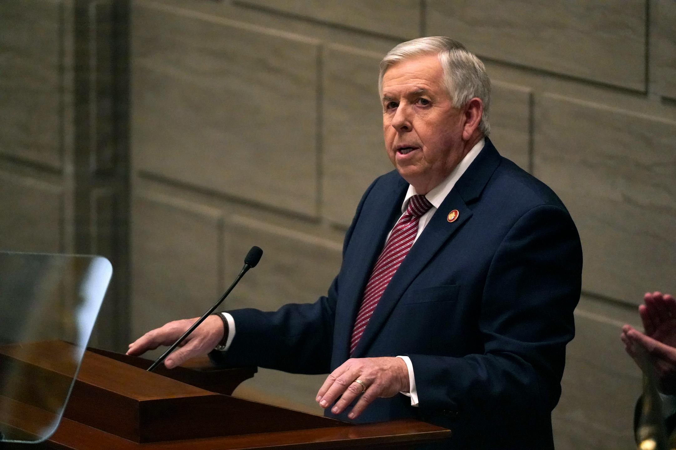 FILE - In this Jan. 27, 2021 file photo, Missouri Gov. Mike Parson delivers the State of the State address in Jefferson City, Mo. Missouri is clashing with the U.S. Department of Justice over a new law banning police from enforcing federal gun rules. In a letter obtained by The Associated Press,&nbsp;Justice Department officials wrote&nbsp;that state lawmakers went too far with the law and noted that federal law trumps state law under the U.S. Constitution's Supremacy Clause. In response, Parson and Attorney General Eric Schmitt wrote a&nbsp;defiant letter&nbsp;stating that they still plan to enforce the new law. (AP Photo/Jeff Roberson, File)