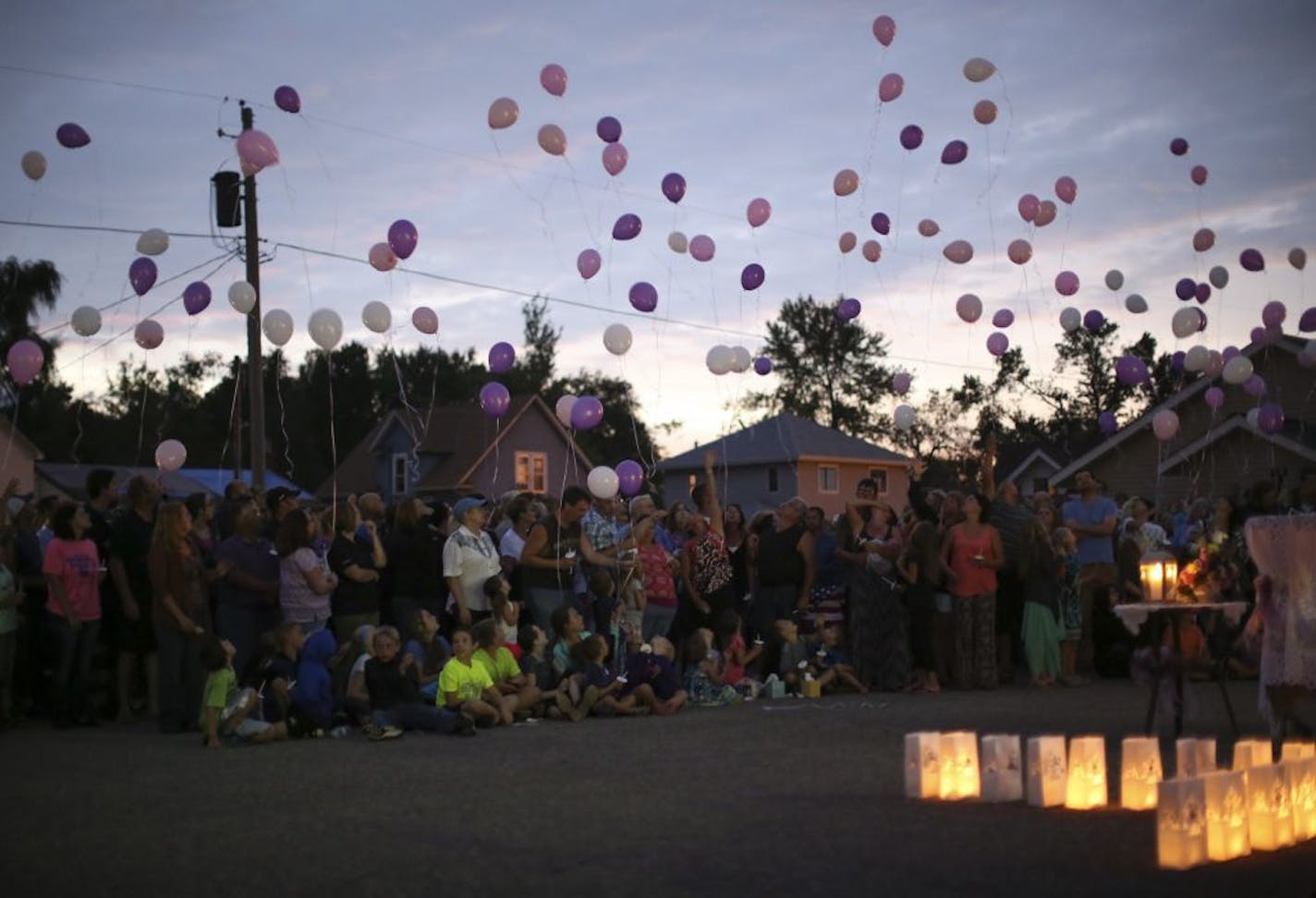 Balloons were released during the prayer vigil for Alayna Ertl Tuesday night in the parking lot of St. Anthony Church in Watkins.