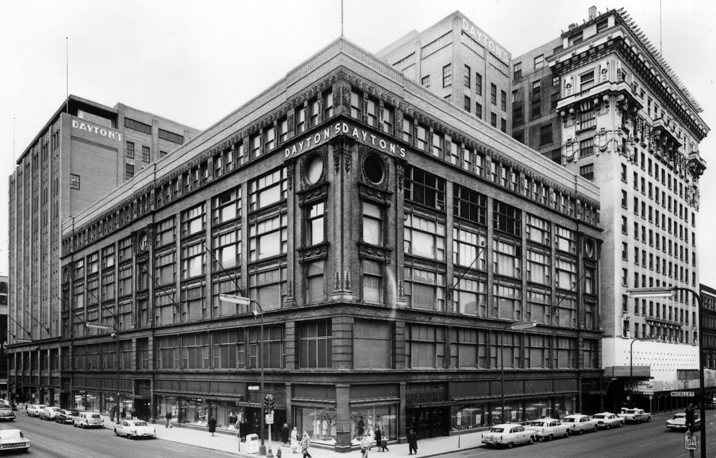 Dayton's department store, Seventh Street and Nicollet Avenue South (now Nicollet Mall), in Minneapolis. Radisson Hotel is shown at right, on Seventh Street // from the Minneapolis - Buildings - Central Loop folder of the 1960 Minneapolis Special Survey Drawer // Photo by Minneapolis Star and Tribune staff photographer Roy Swan, March 1960. ORG XMIT: MIN2015110310570939