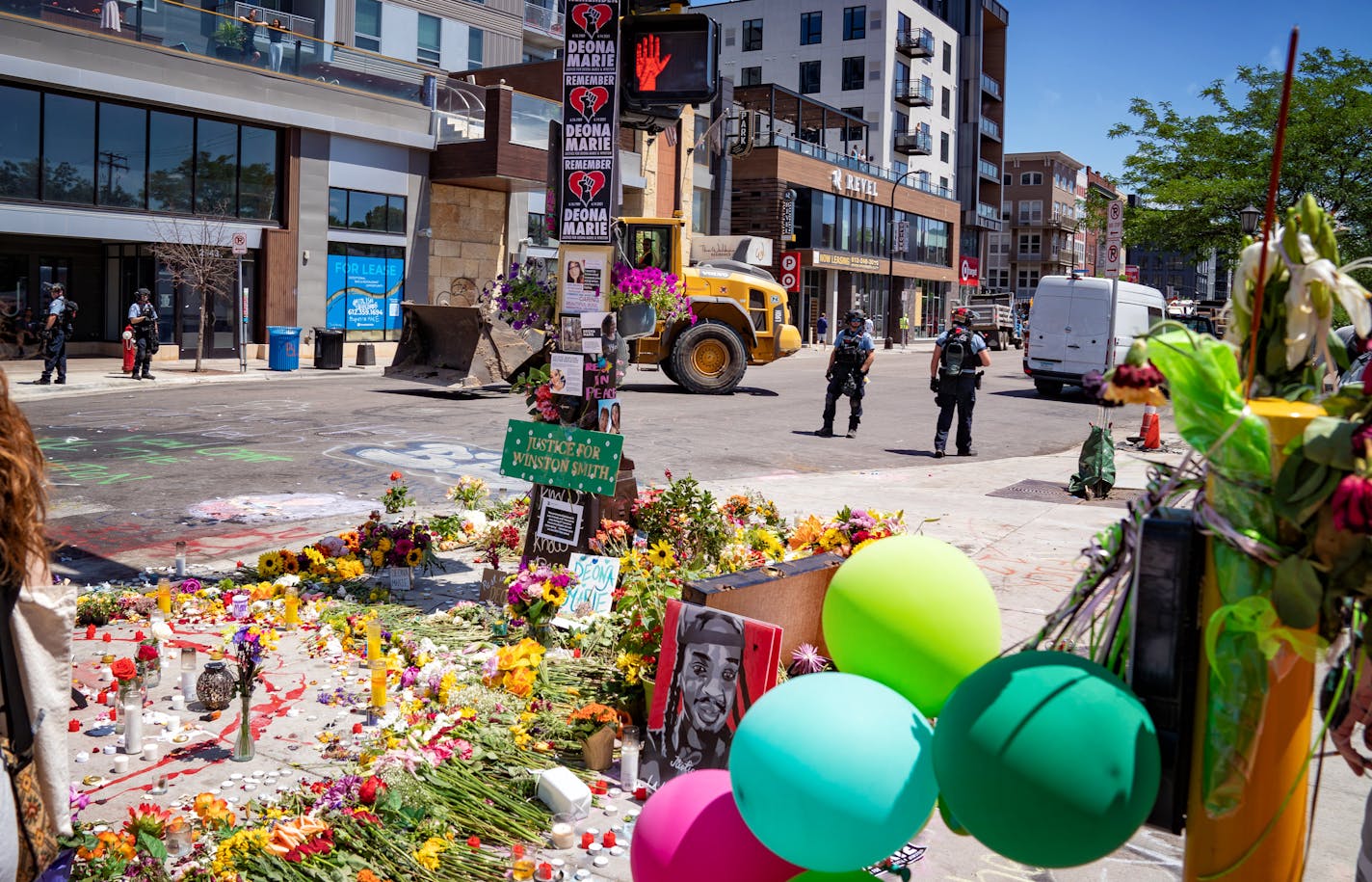 Police and Minneapolis work crews swept in just after noon to remove to remove barricades set up by protesters along W Lake St and Fremont Ave, creating a "no-go" zone in Uptown at Lake and Girard. In the area where Deona Knajdek and Winston Smith were killed.