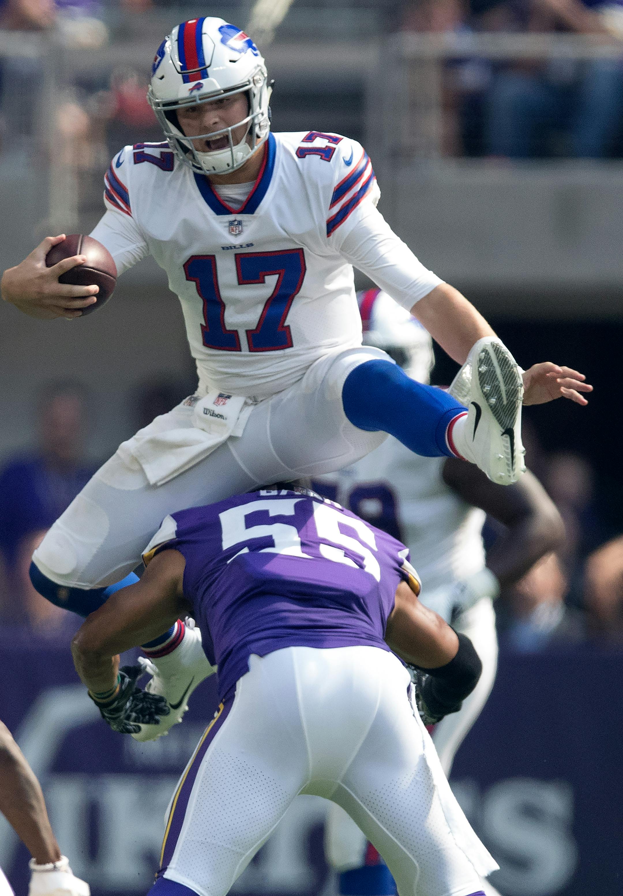 Buffalo Bills quarterback Josh Allen (17) jumped over Minnesota Vikings linebacker Anthony Barr (55) picking up a first down on the the play in the first quarter Minnesota Vikings kicker Dan Bailey (55)US Bank Stadium Sunday September 23, 2018 in Minneapolis, MN. ] JERRY HOLT ï jerry.holt@startribune.com