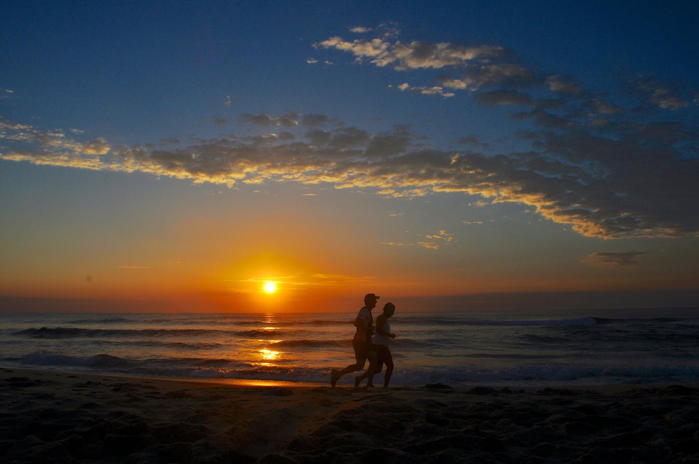 Runners at sunrise