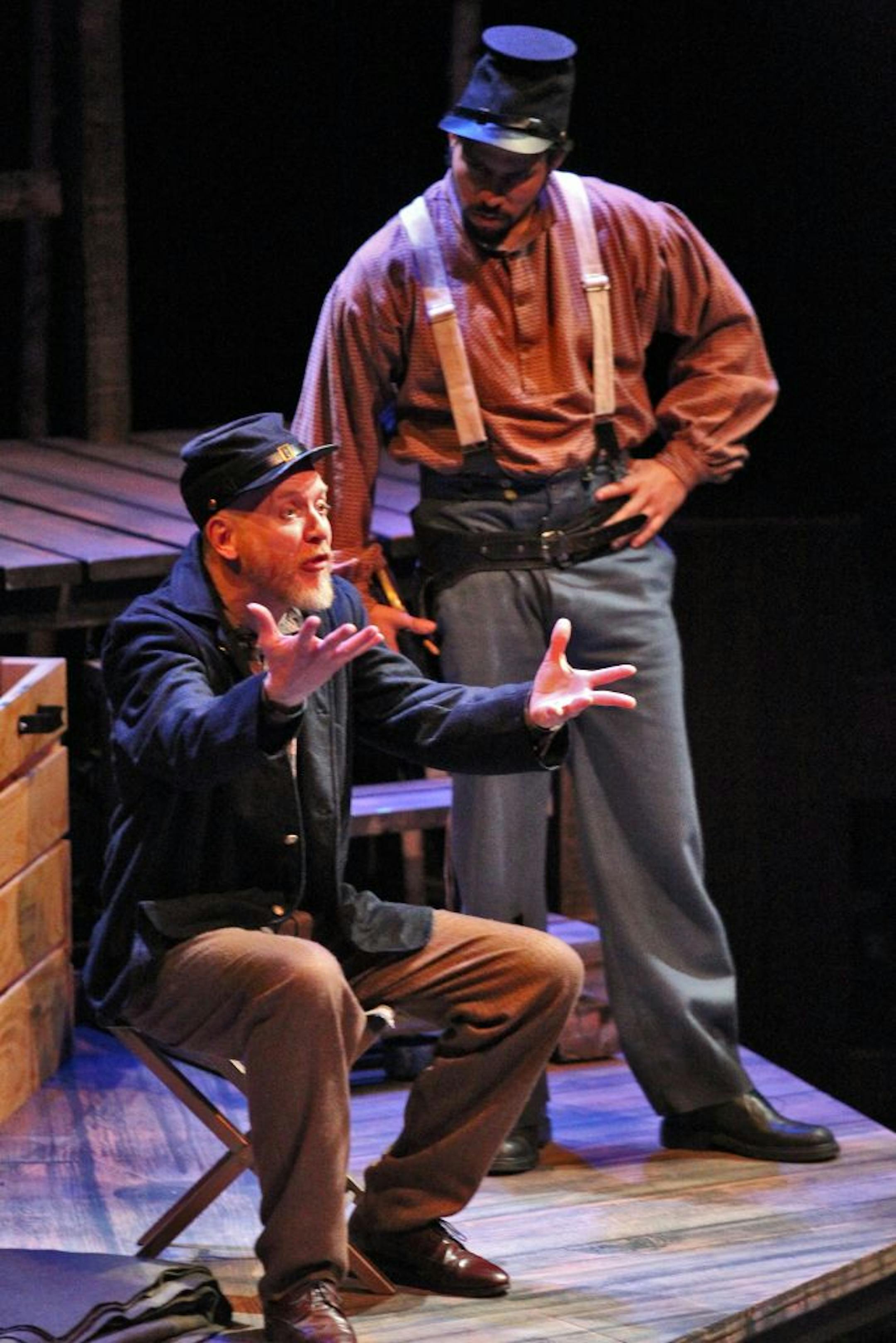 Joel Raney (seated) and Santino Craven in "A Civil War Christmas" at the History Theatre in St. Paul.